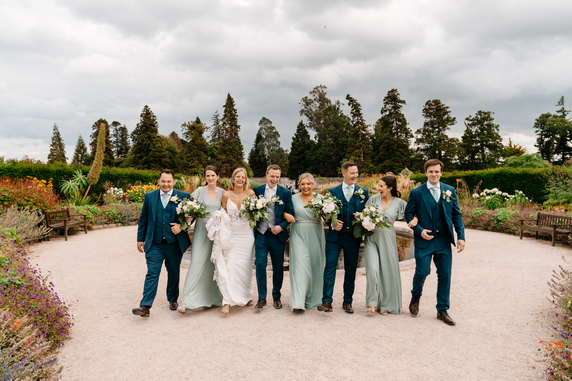 Bride celebrating with her bridesmaids at Powerscourt House in Wicklow.