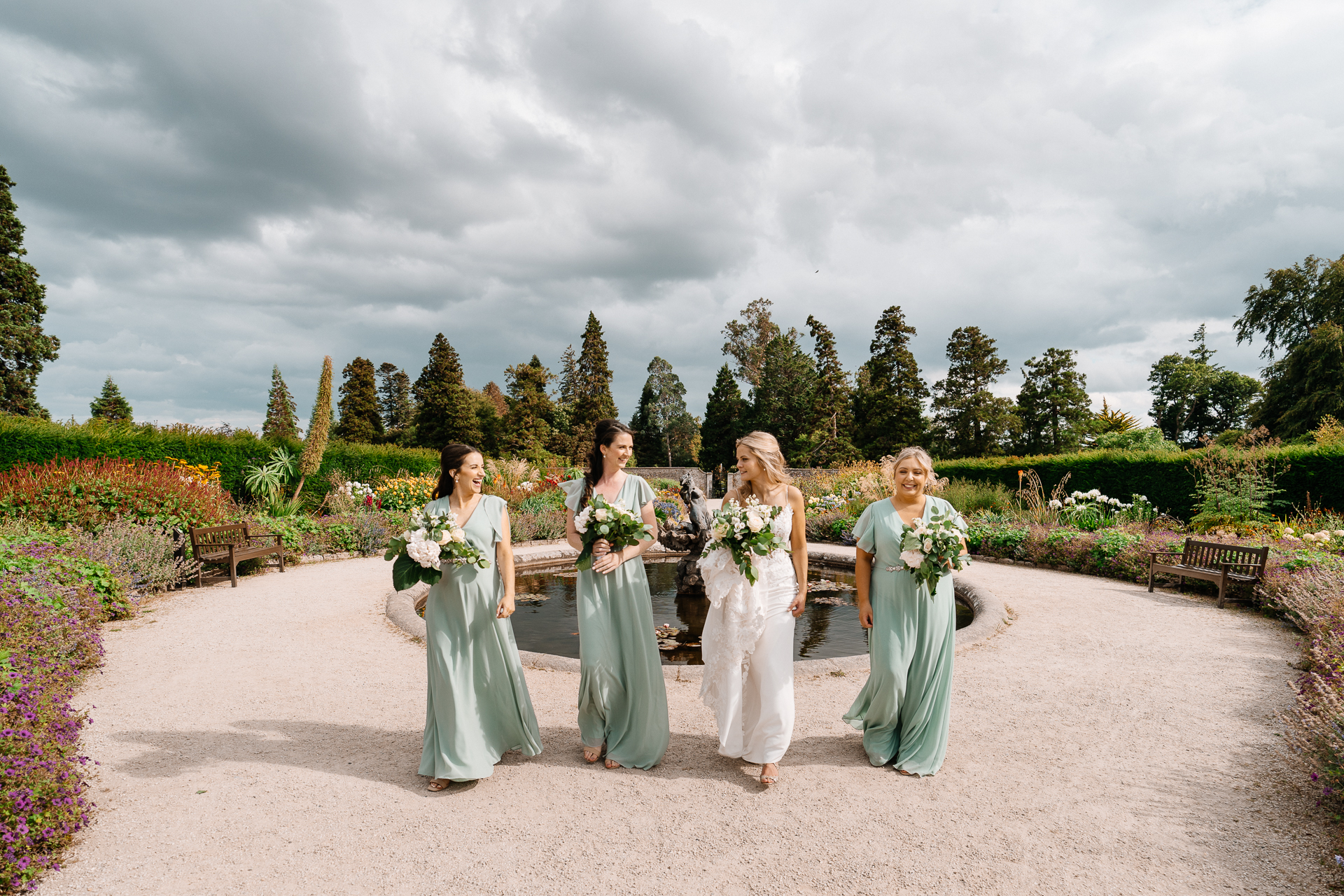 Bride celebrating with her bridesmaids at Powerscourt House in Wicklow.