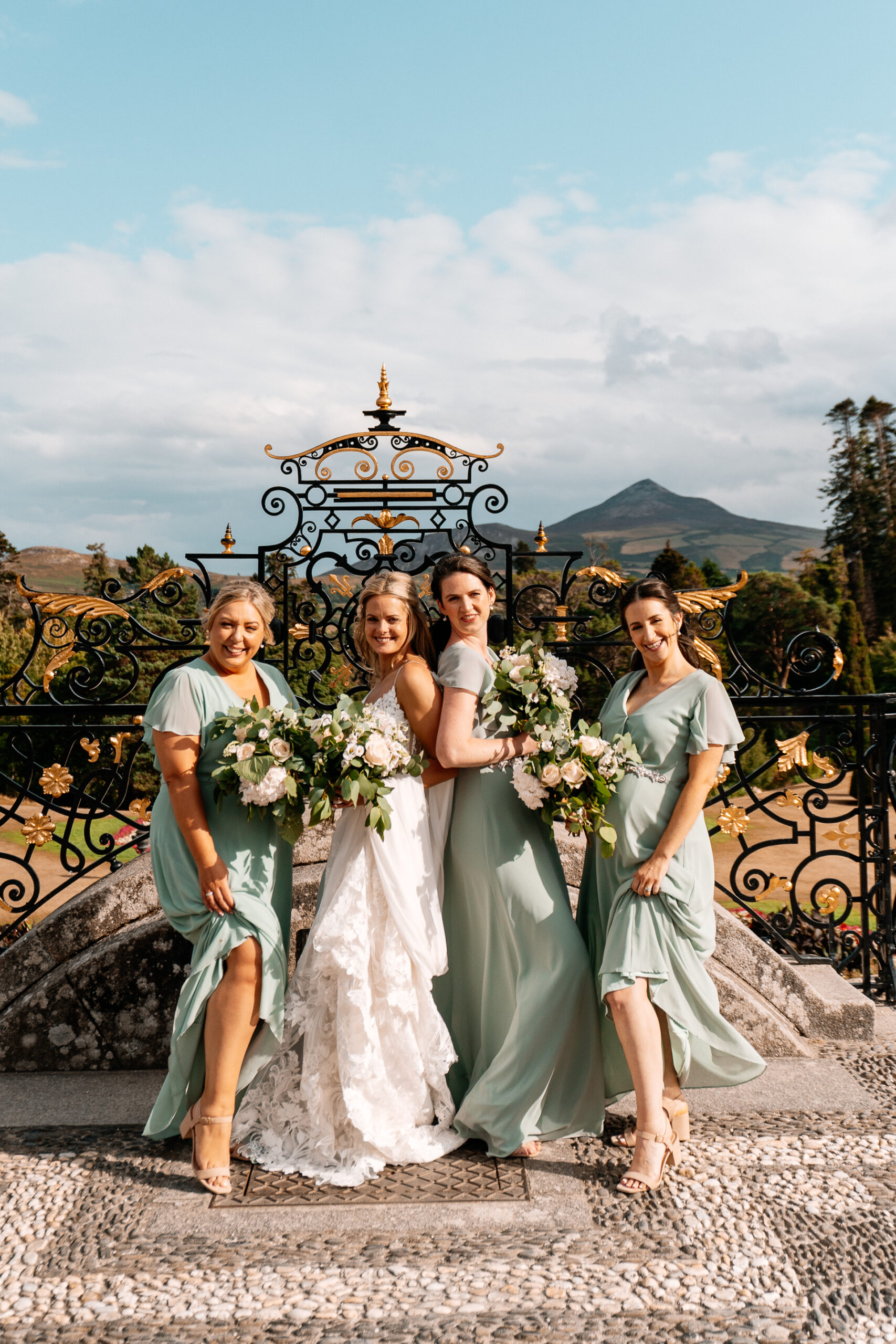 Bride celebrating with her bridesmaids at Powerscourt House in Wicklow.