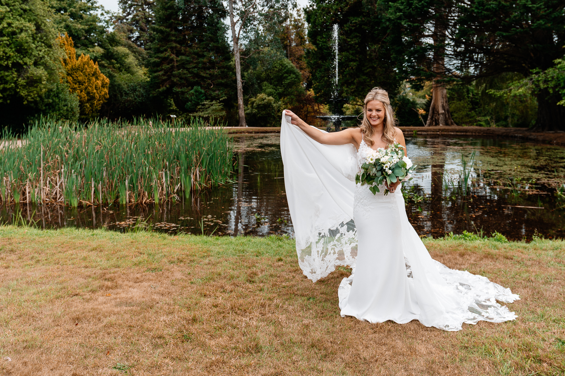 Bride and groom sharing a romantic moment at the gardens of Powerscourt House in Wicklow.