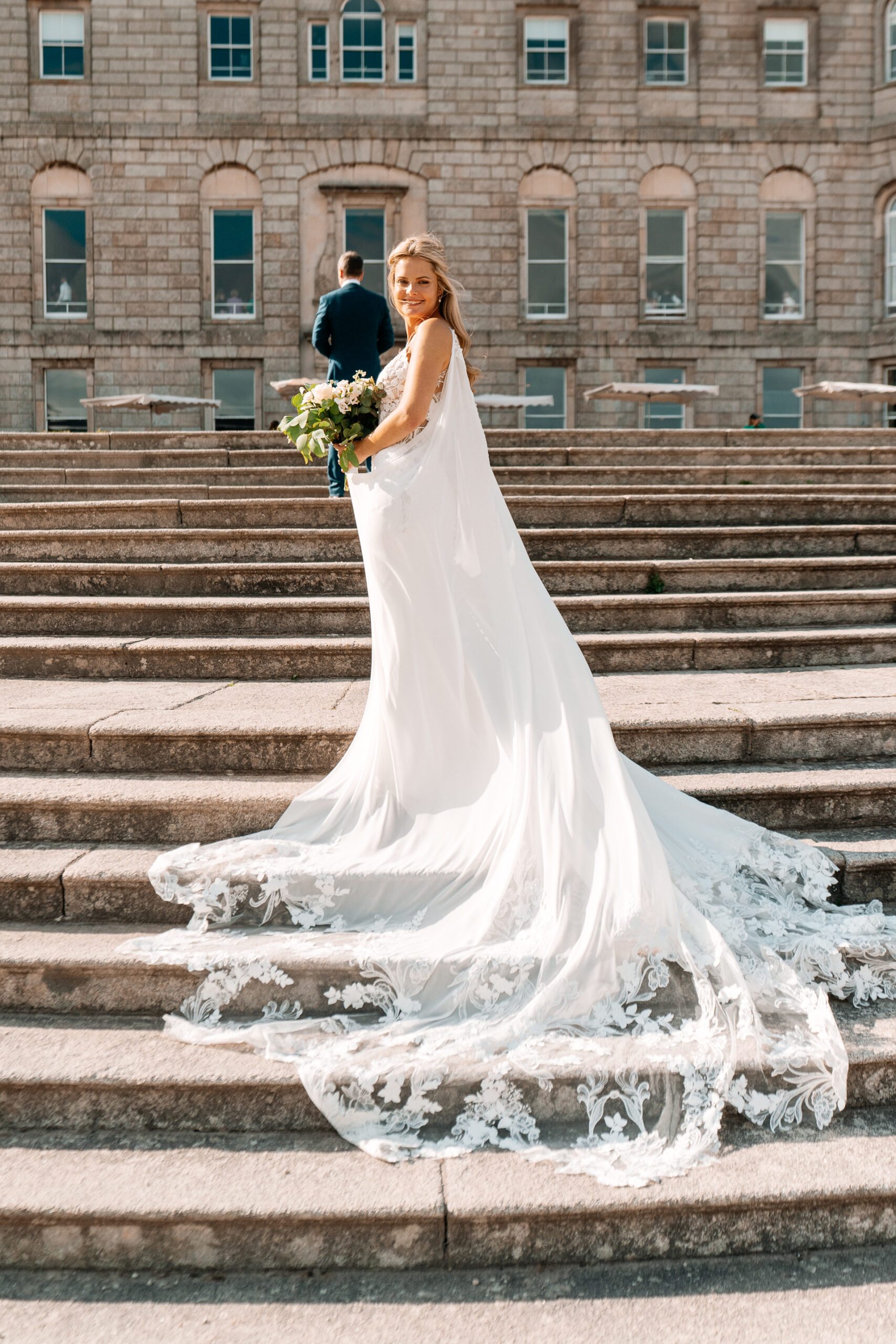 Bride and groom sharing a romantic moment at the gardens of Powerscourt House in Wicklow.