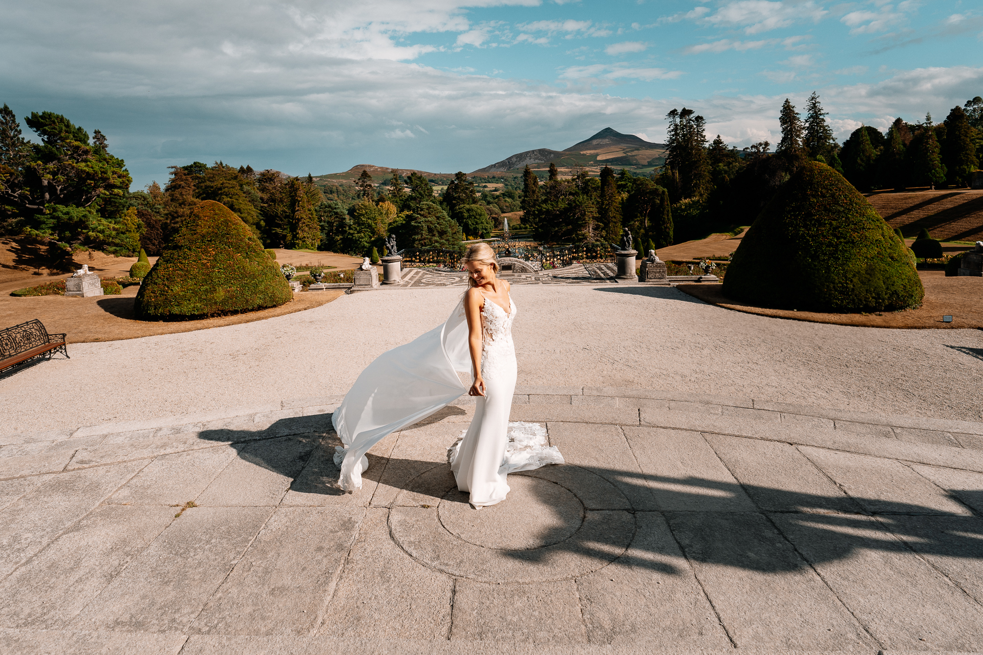 Bride and groom sharing a romantic moment at the gardens of Powerscourt House in Wicklow.