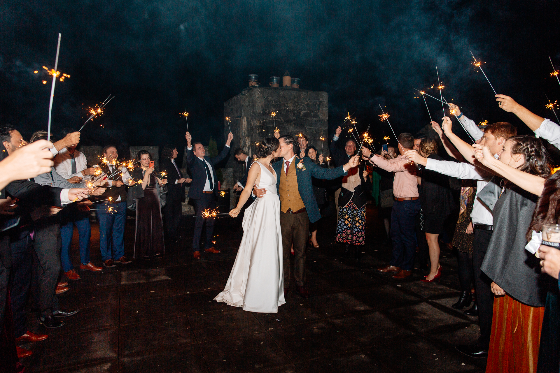 A group of people holding sparklers