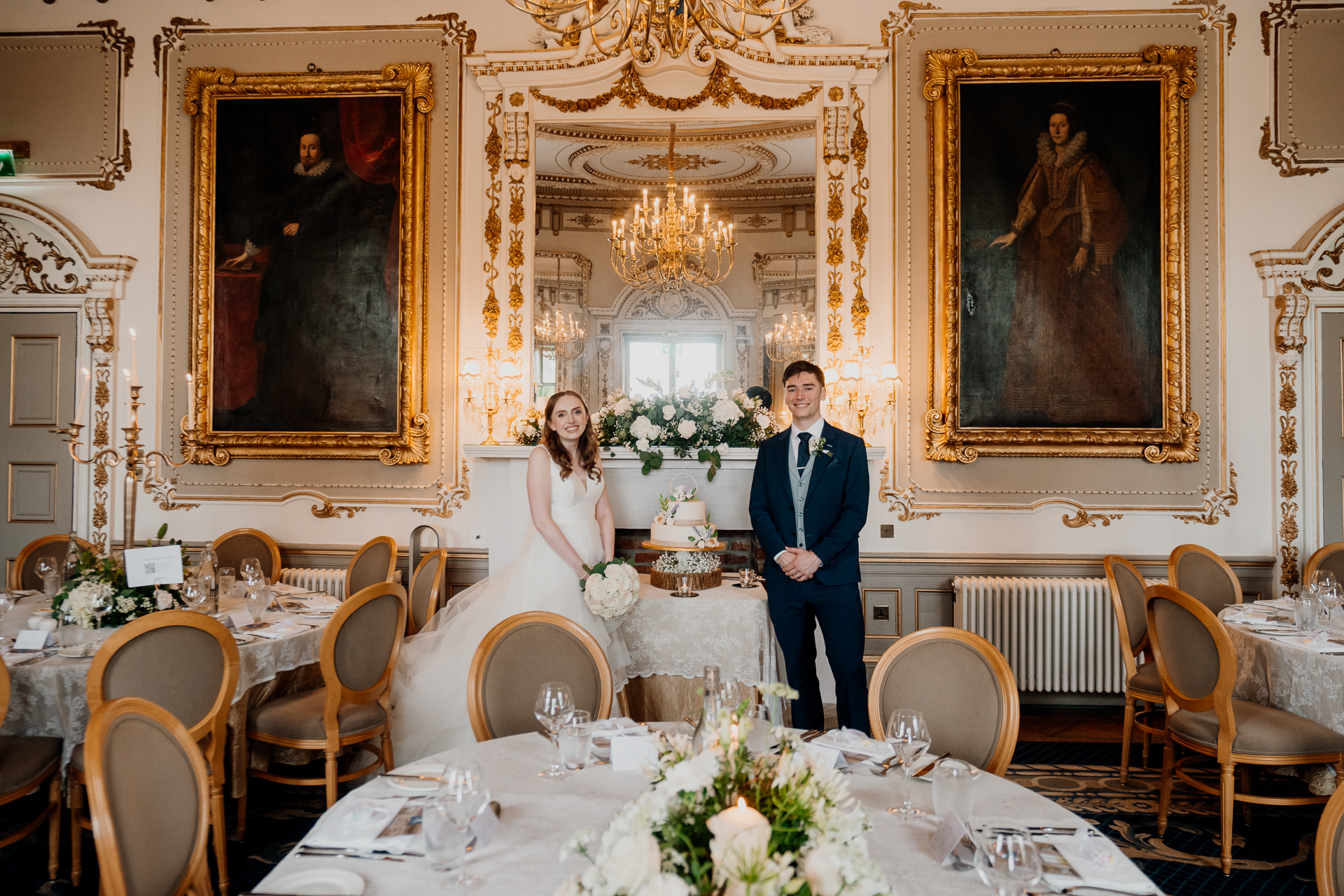 Bride and groom posing inside the elegant reception hall at Markree Castle, a stunning wedding venue in Sligo, Ireland.

