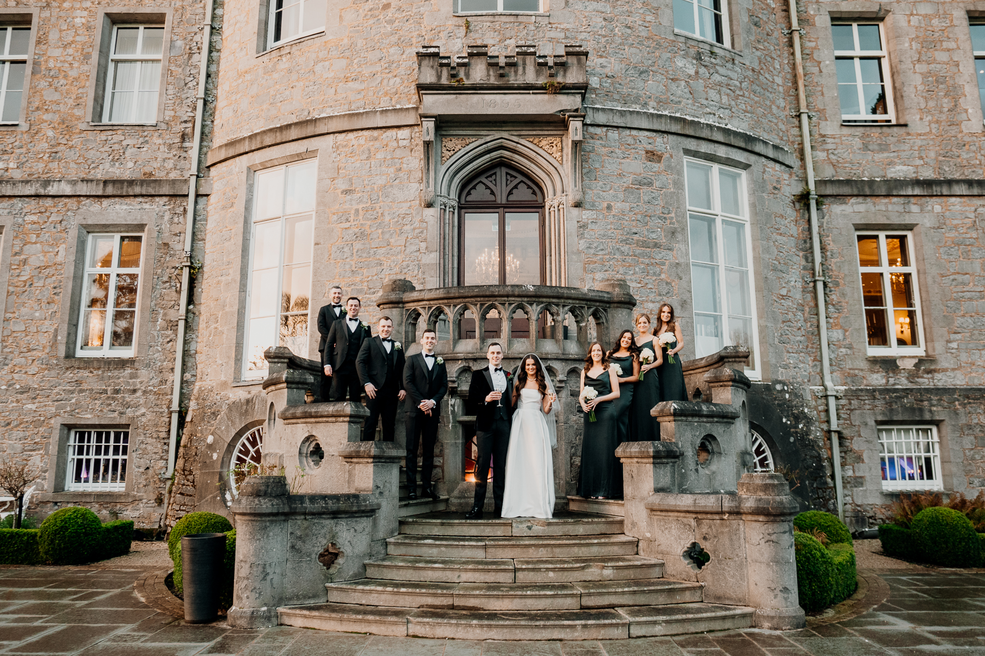 A group of people standing on stairs outside a building