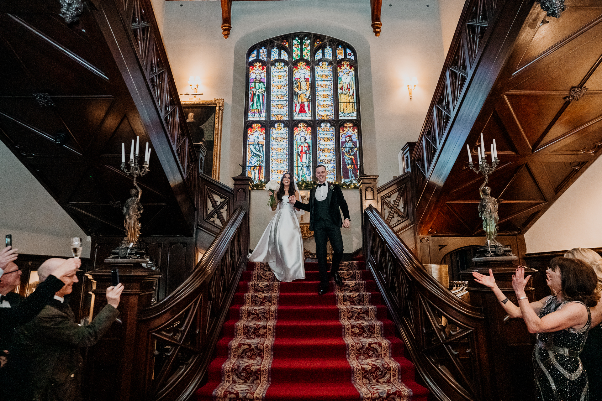 A bride and groom walking down the aisle of a church