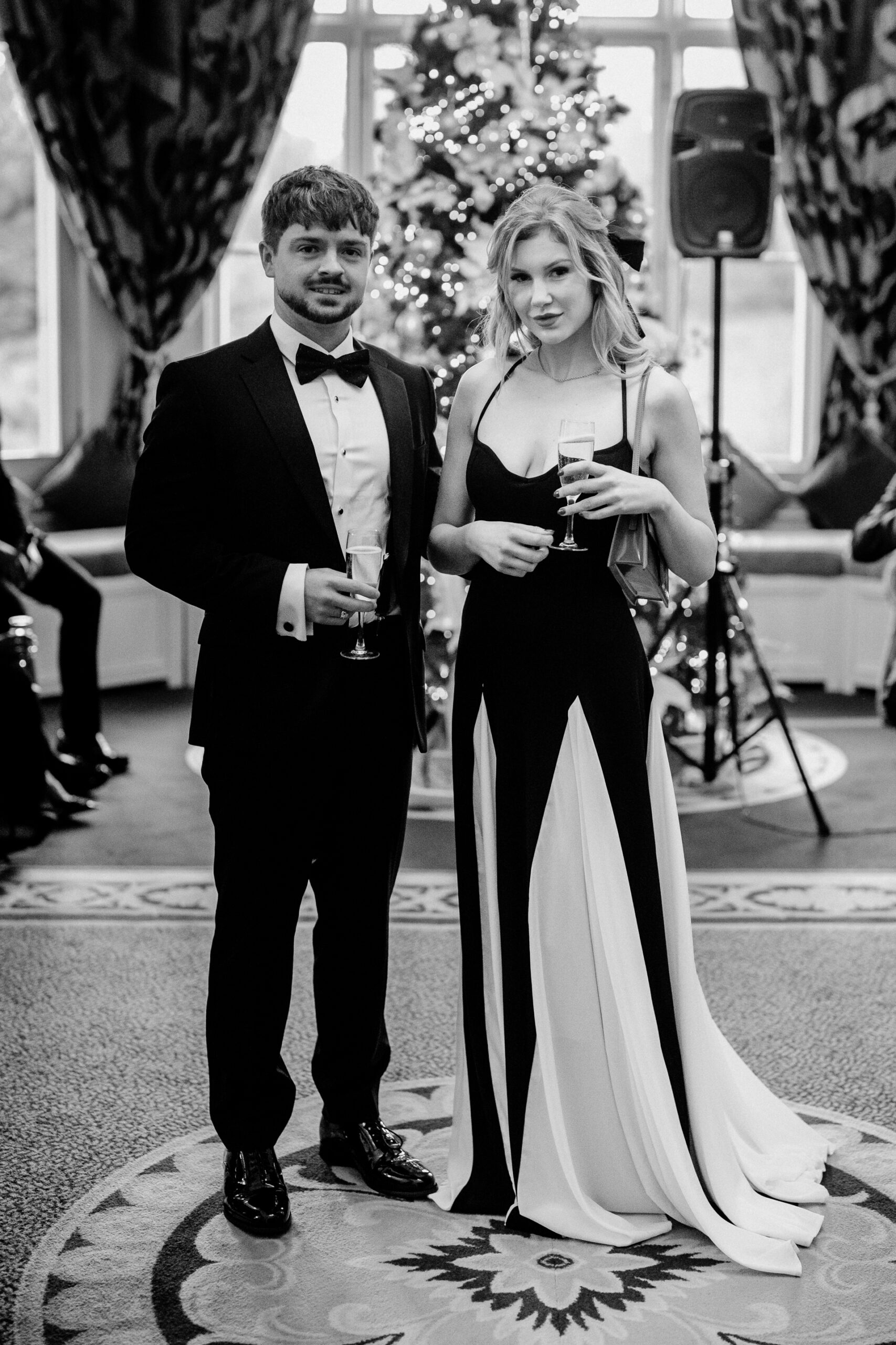 A man and woman holding wine glasses