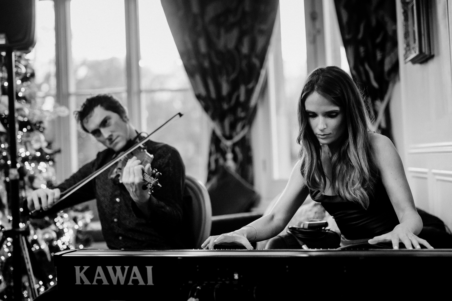 A man and woman playing instruments
