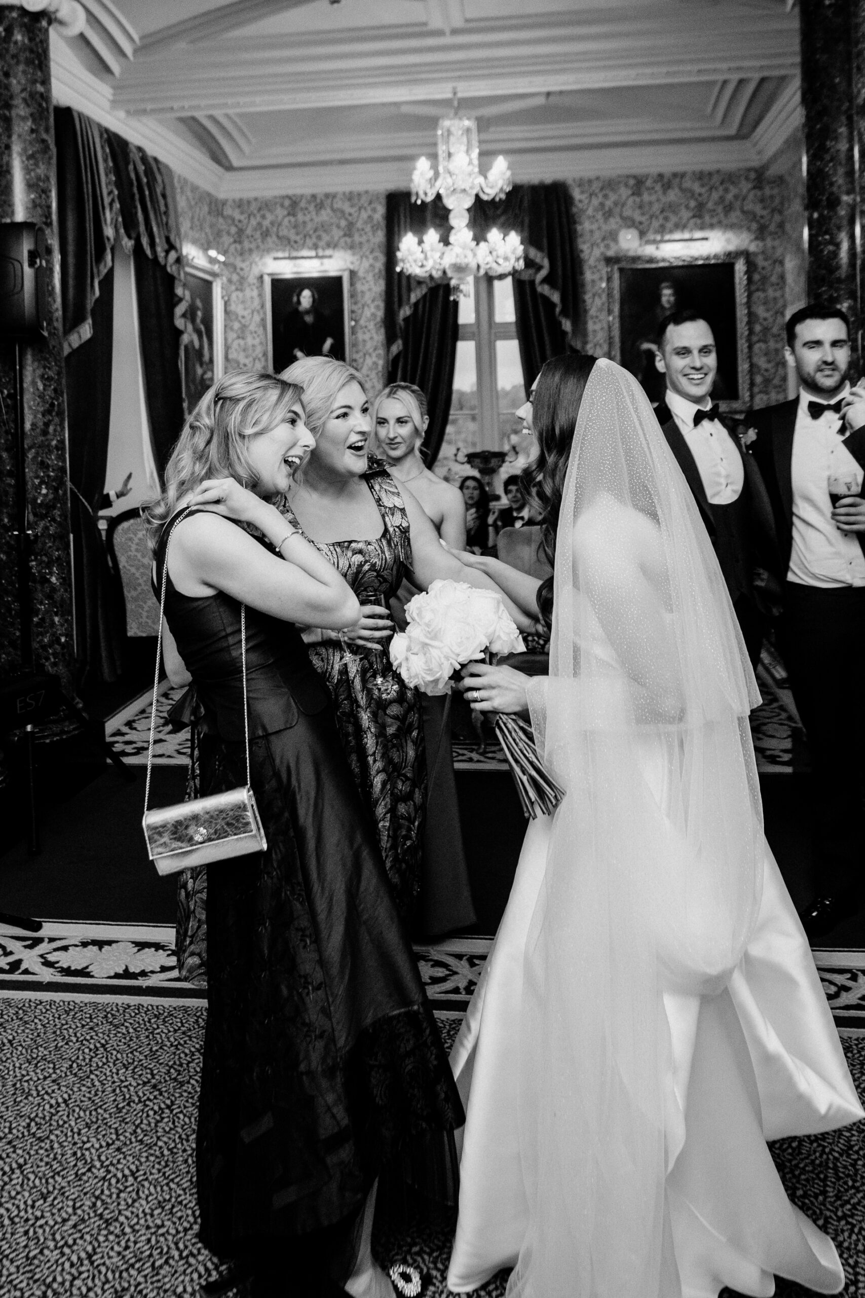 A woman in a wedding dress kissing a man in a suit
