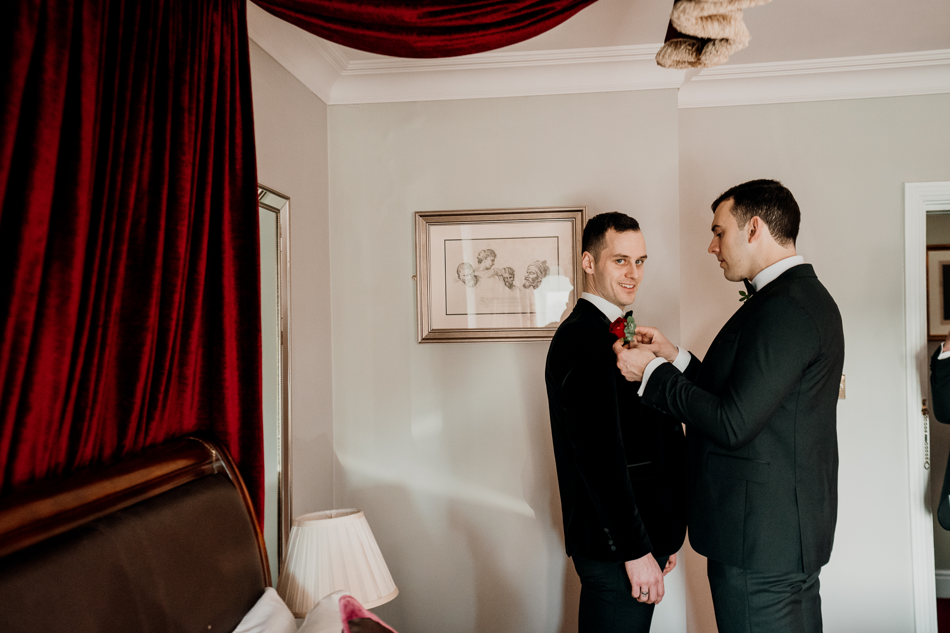A couple of men stand in a room