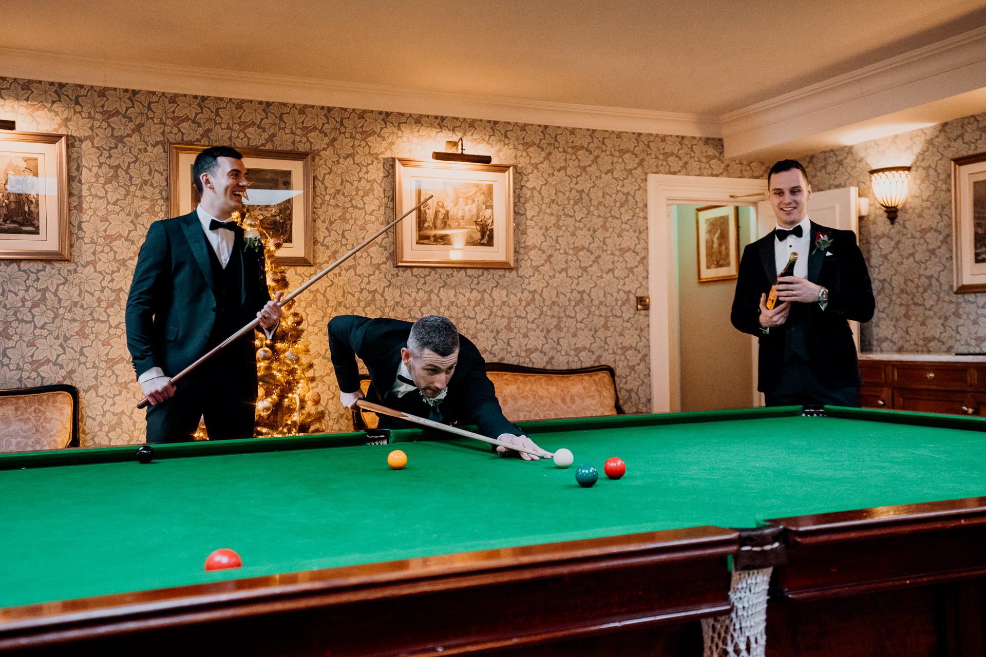 A group of men playing pool