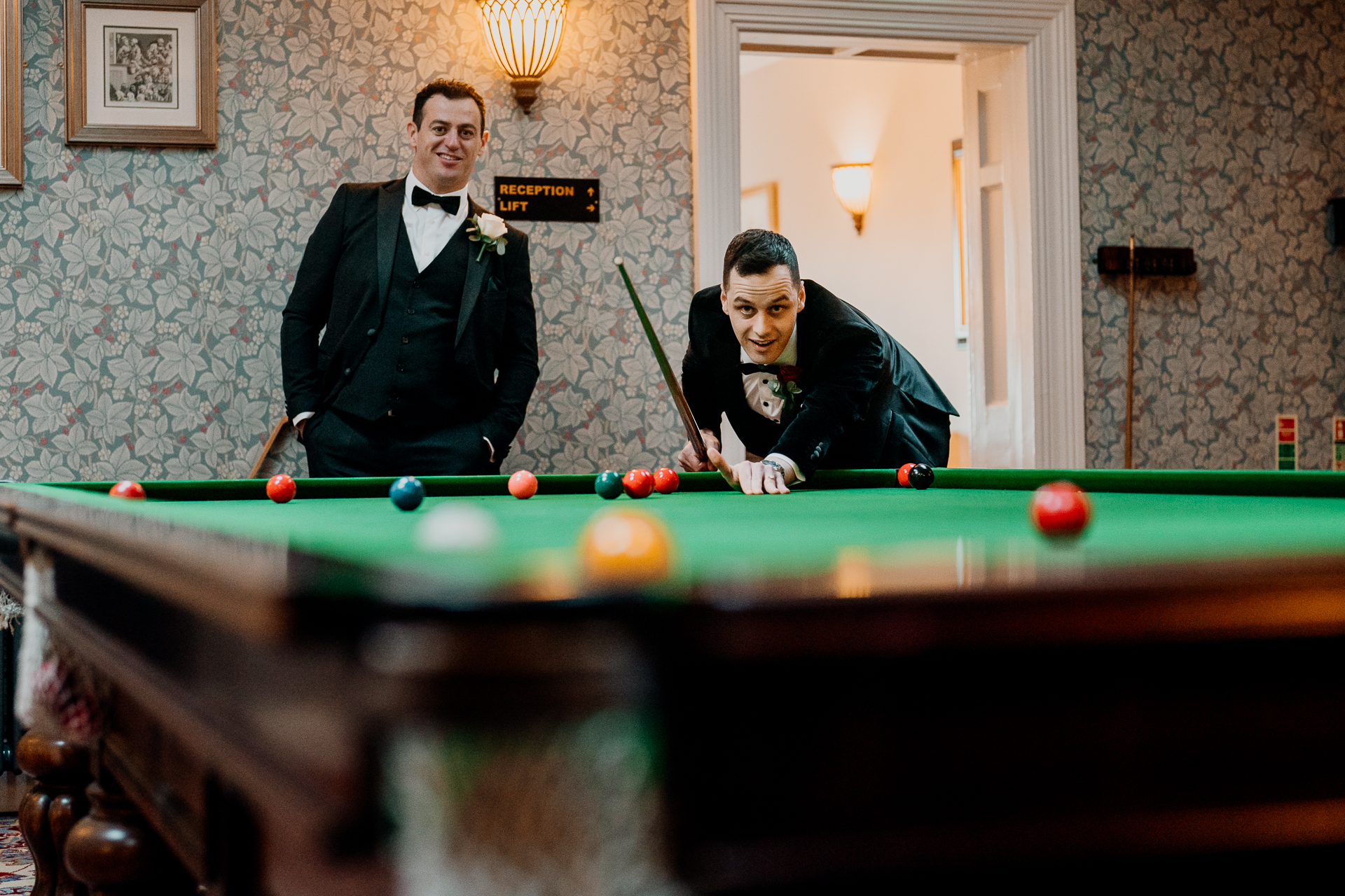 Two men playing pool