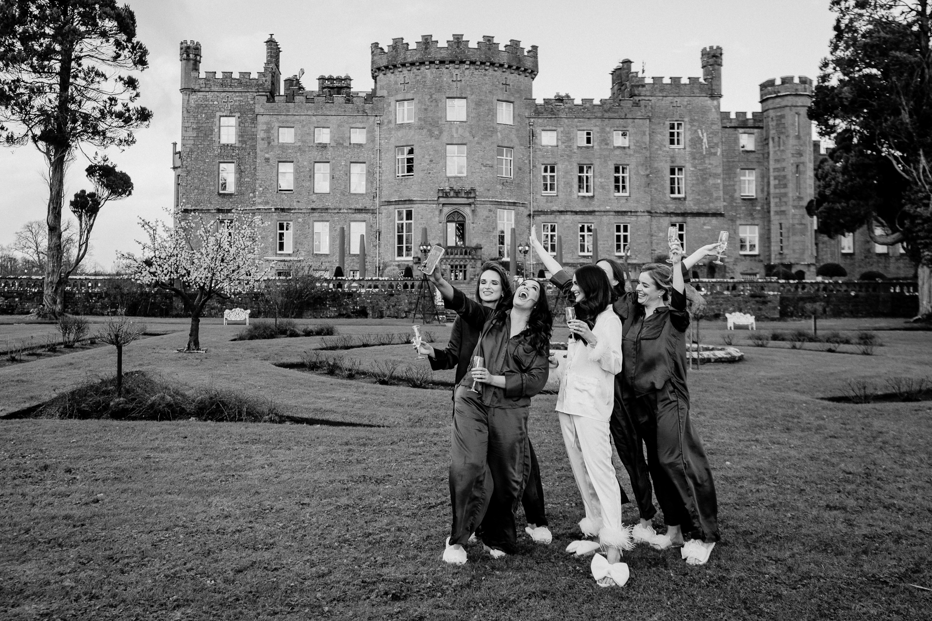 A group of people posing for a photo in front of a building
