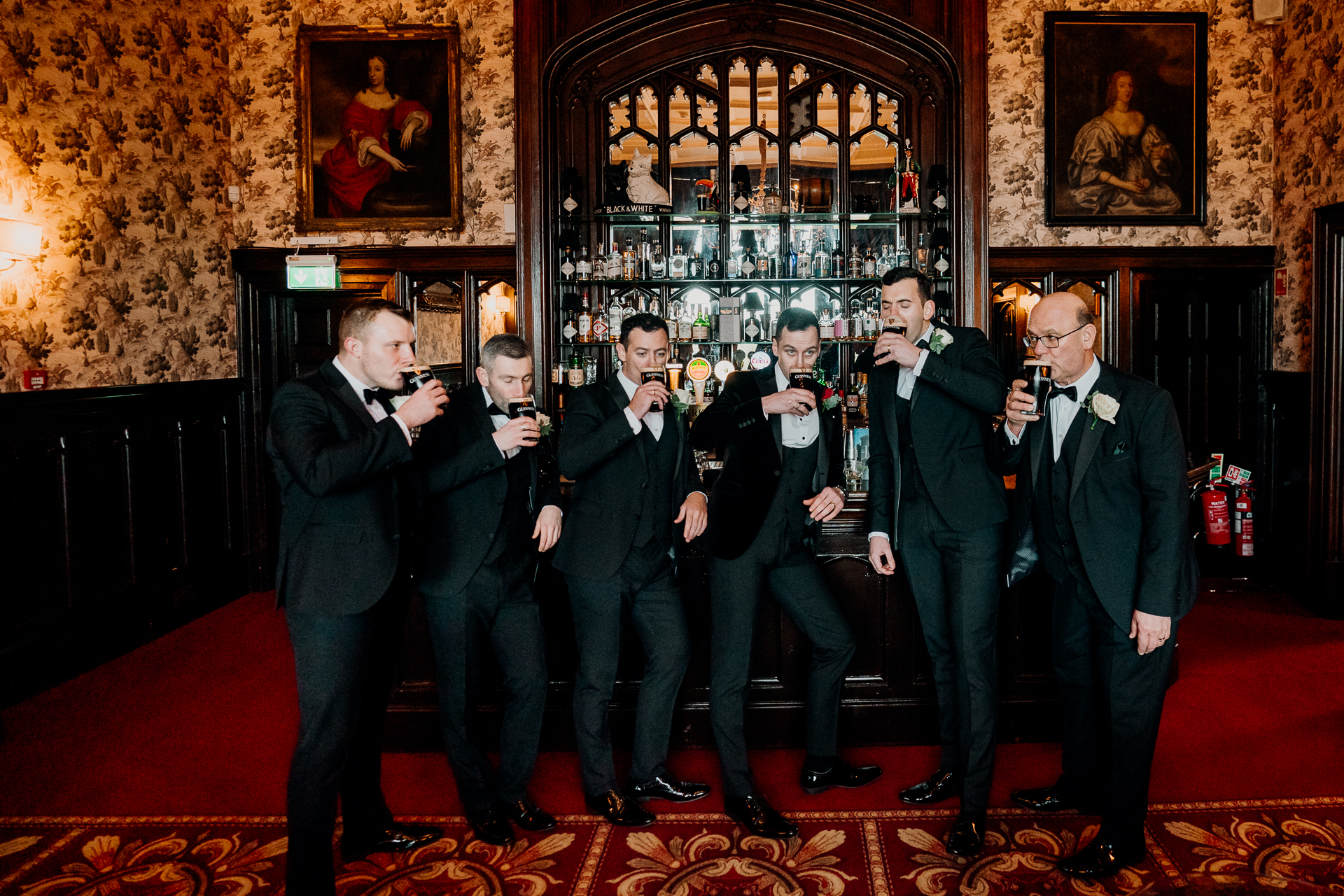 A group of men in suits standing in a room