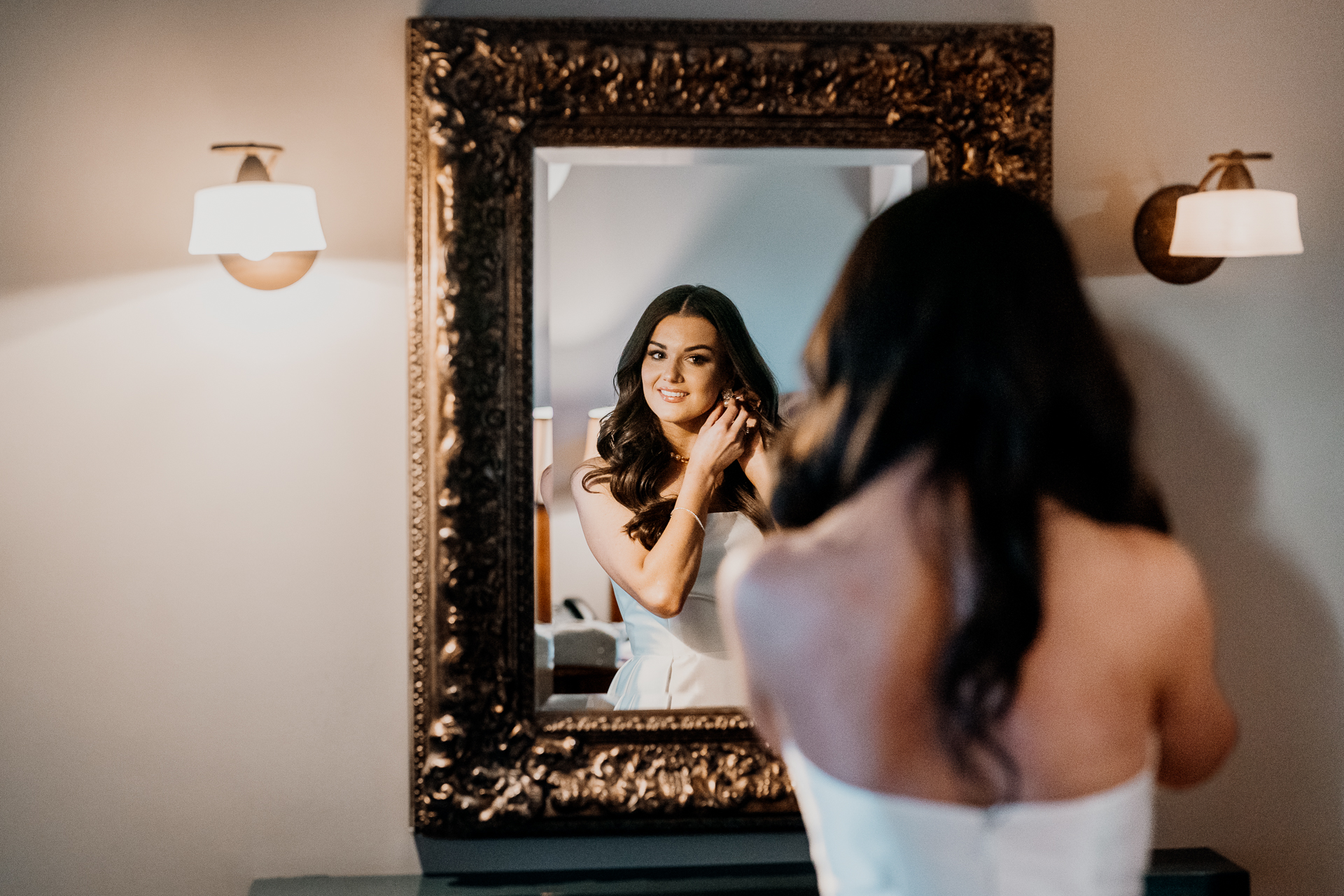 A woman looking at a mirror