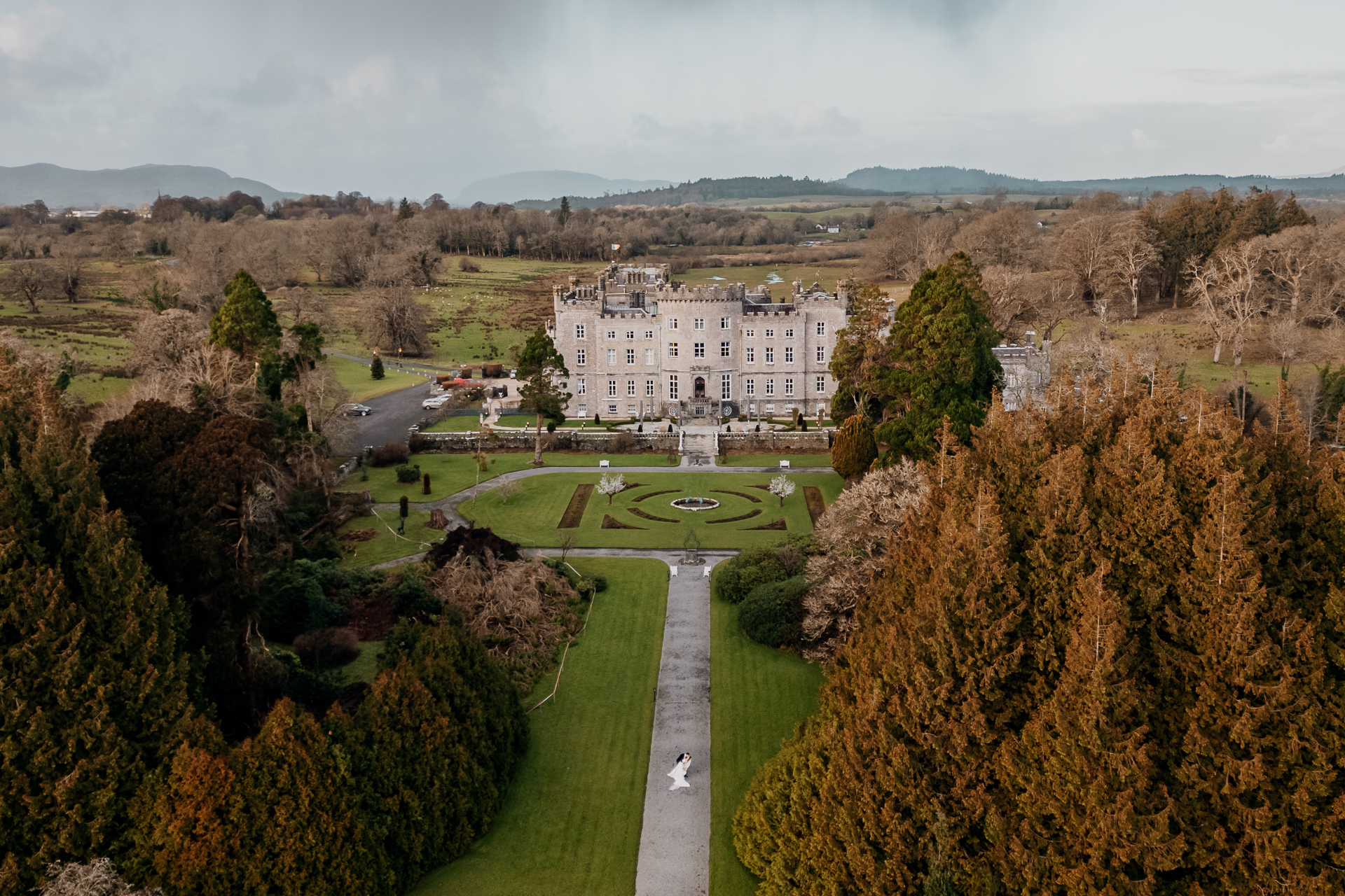 A large white building surrounded by trees