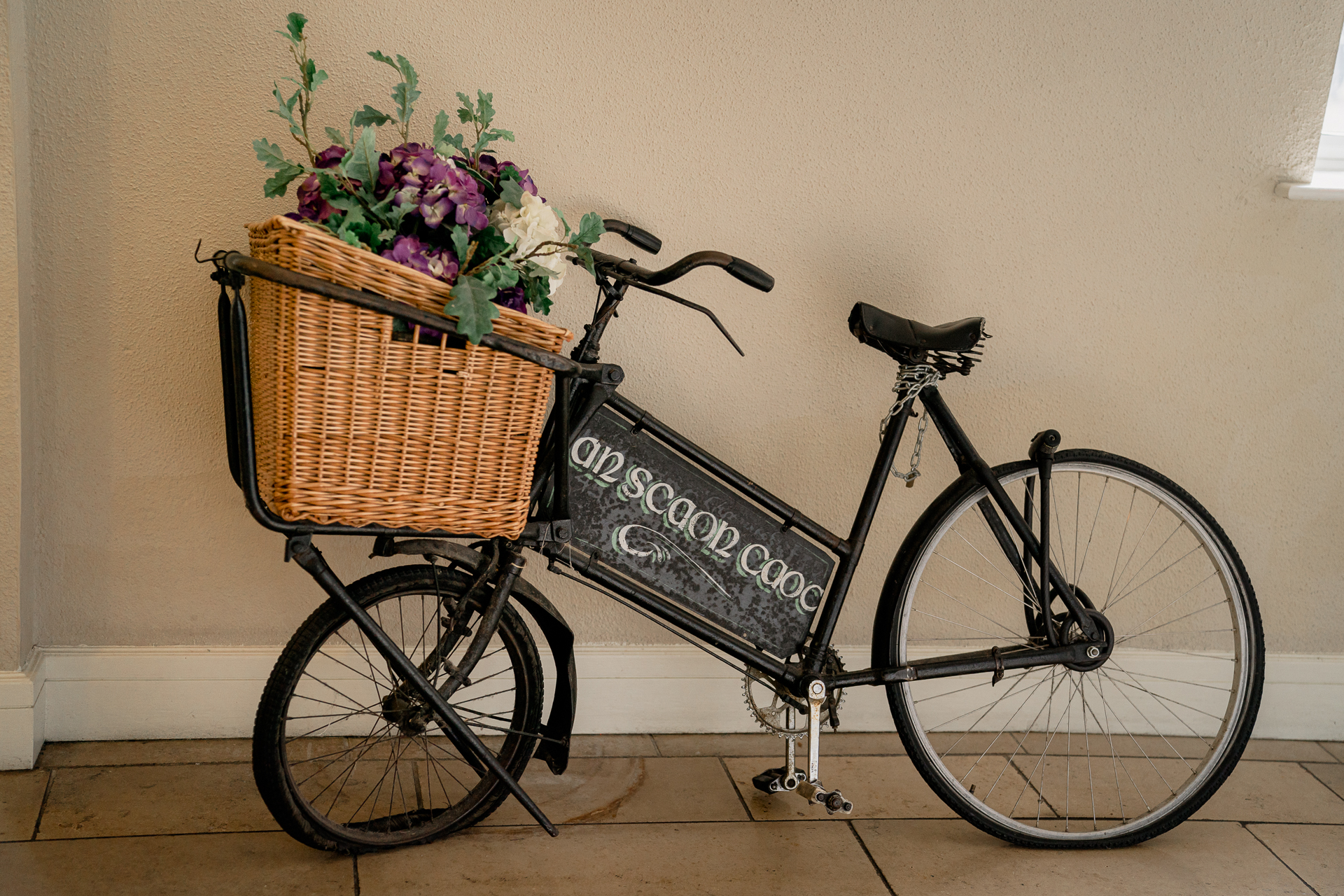 A bicycle with a basket of flowers