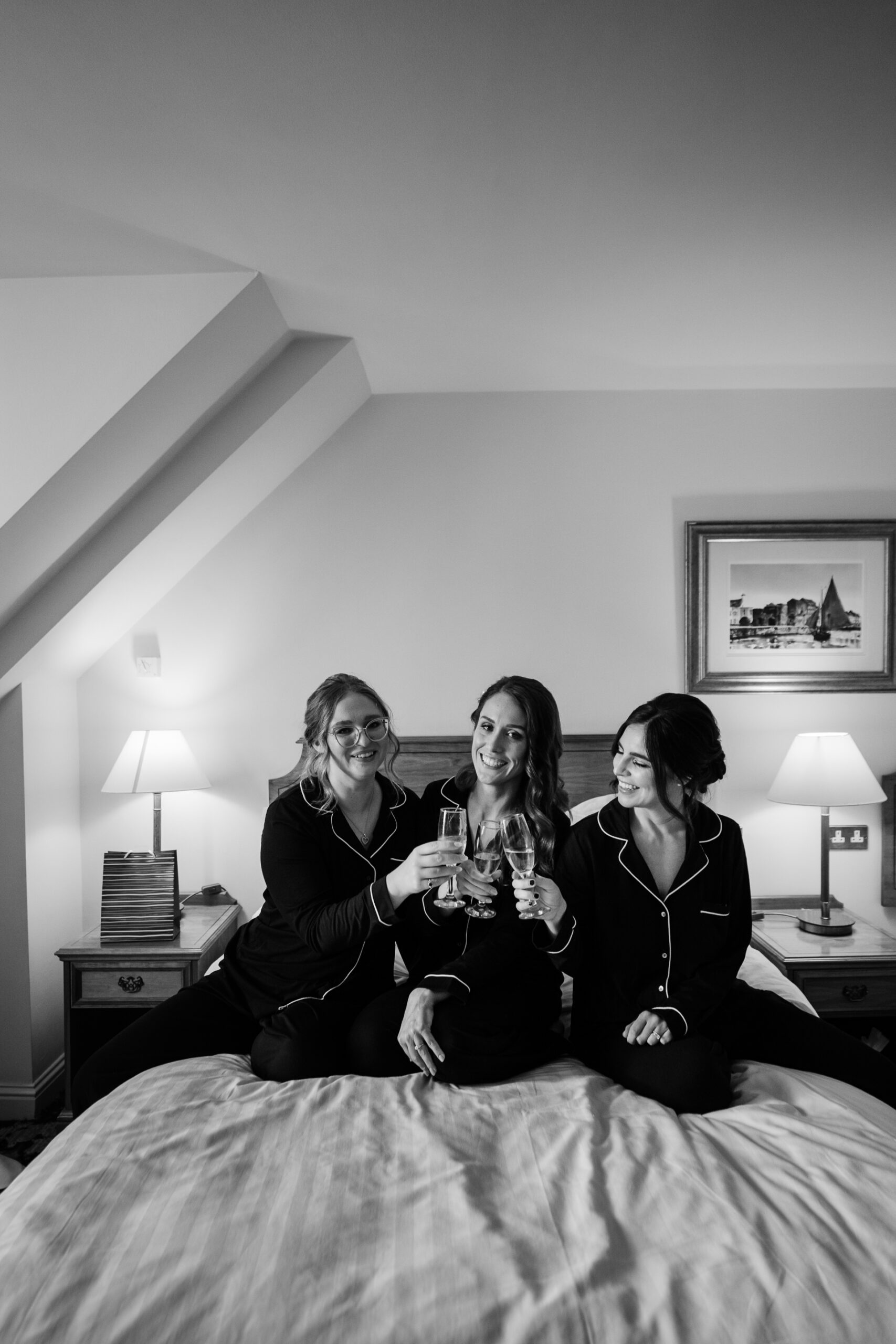 A group of women sitting on a bed