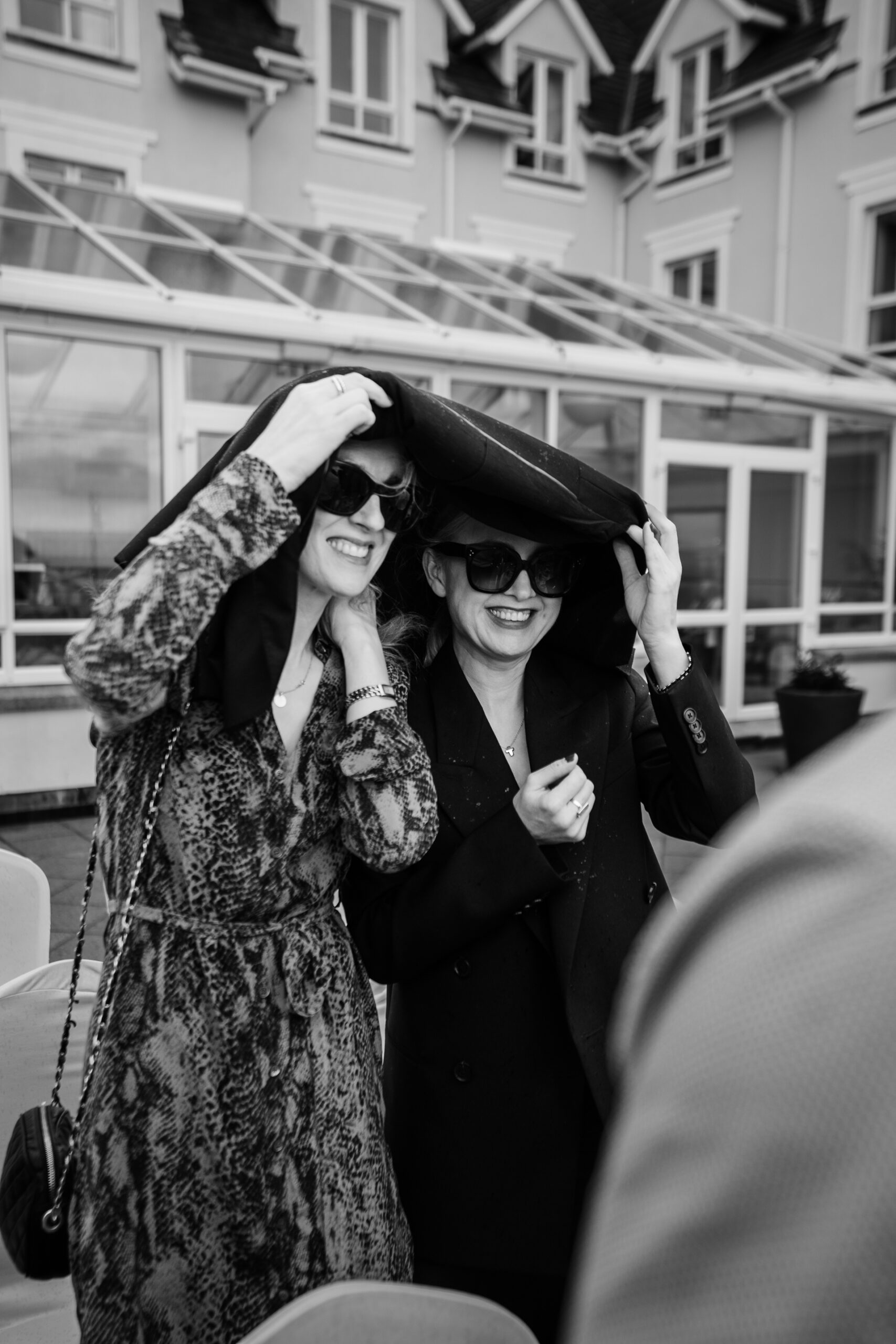 A couple of women wearing hats and sunglasses