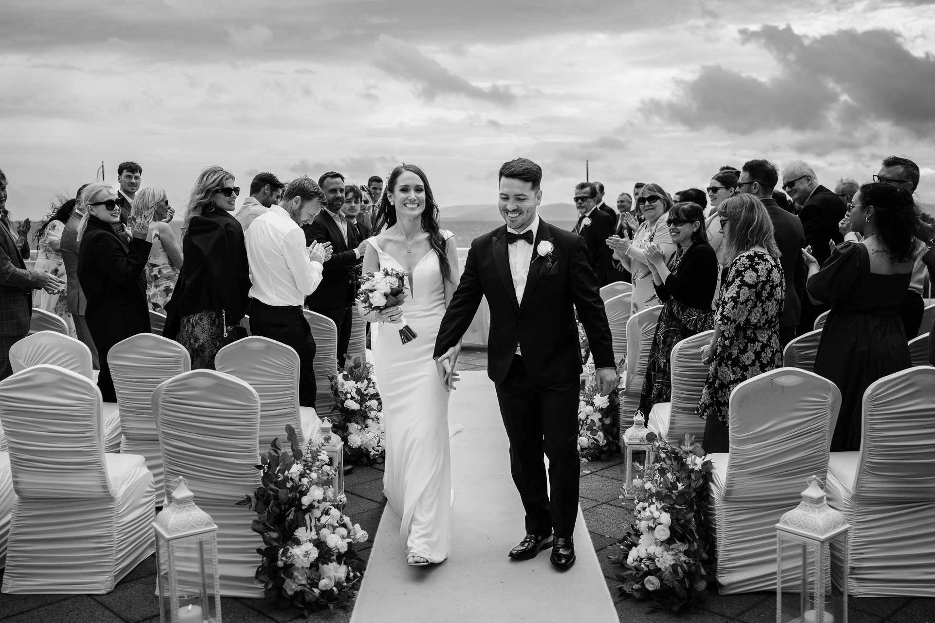 A man and woman walking down a aisle