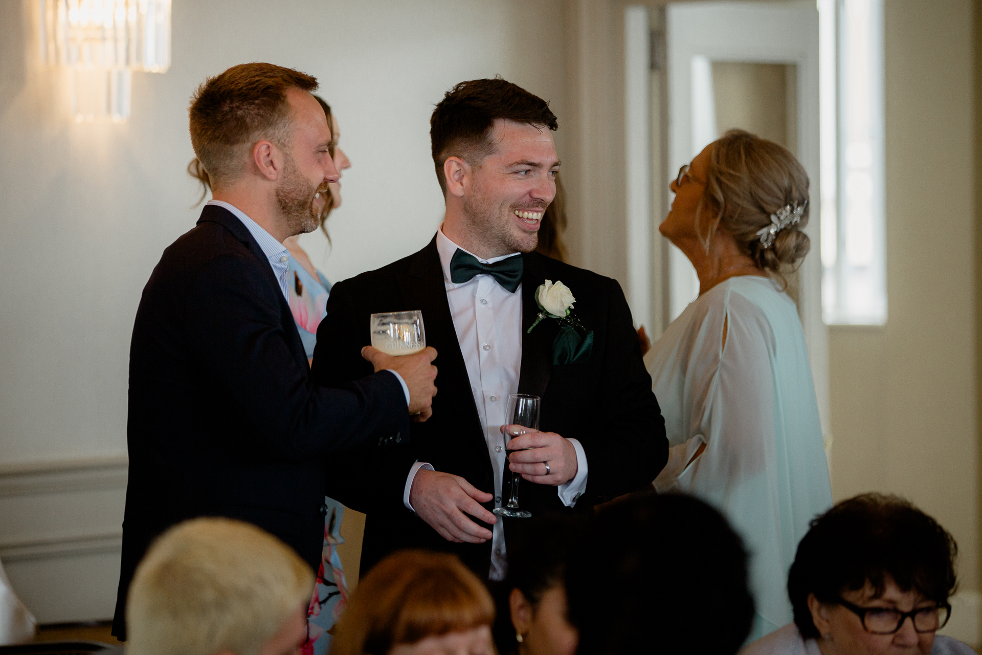 A man and woman holding drinks