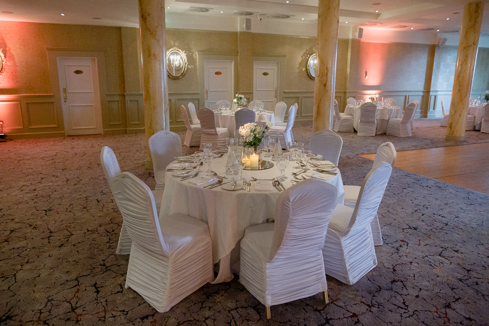 A dining room with white chairs