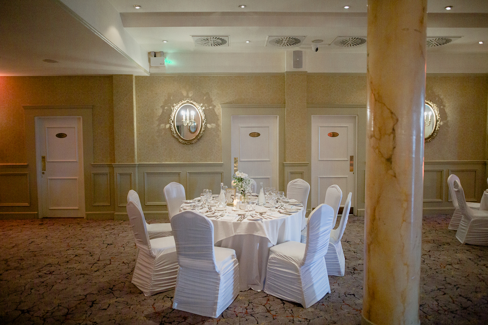 A dining room with a table set