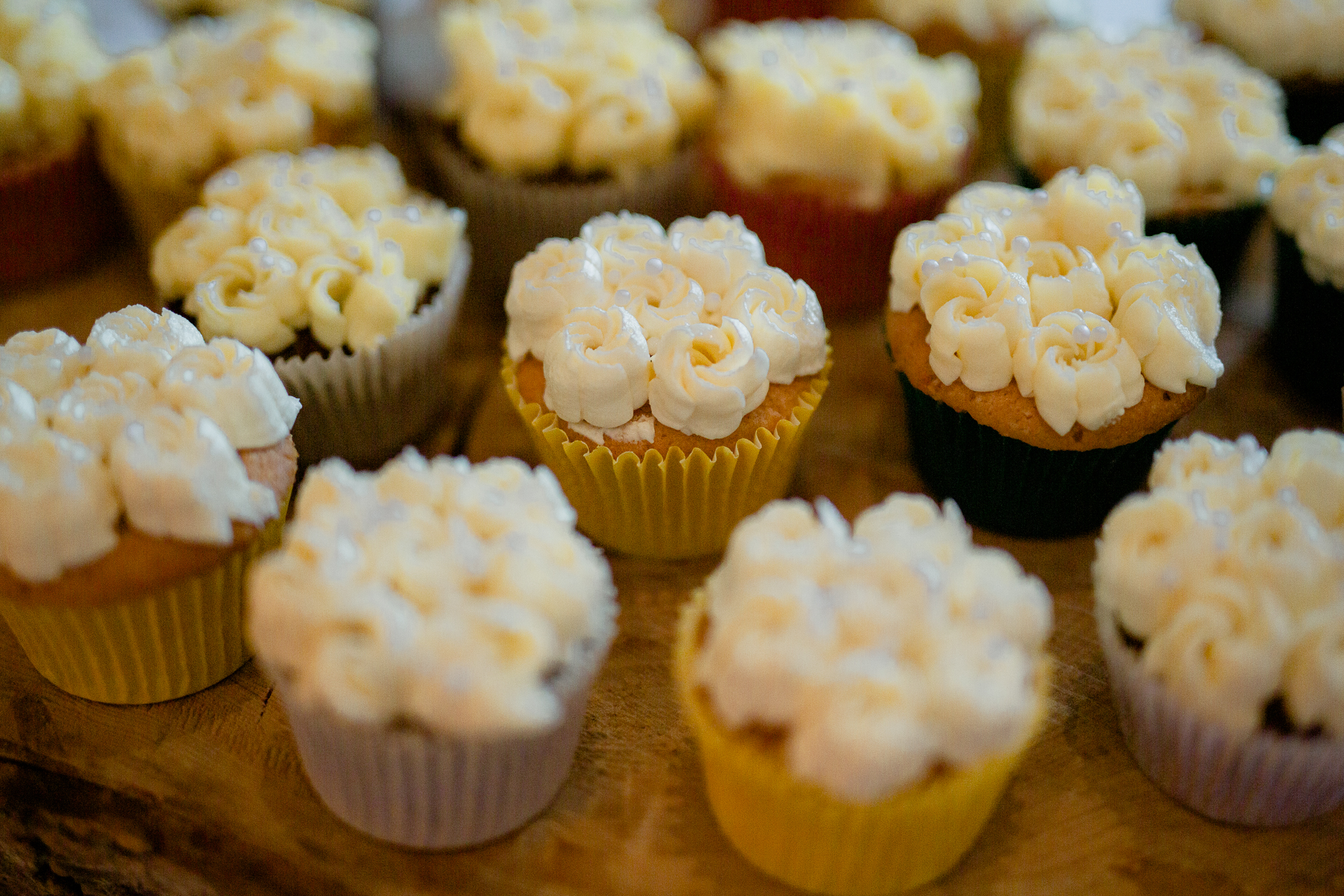 A group of cupcakes with white frosting