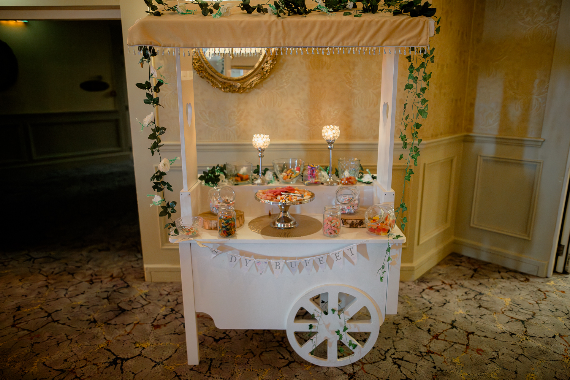 A table with candles and flowers