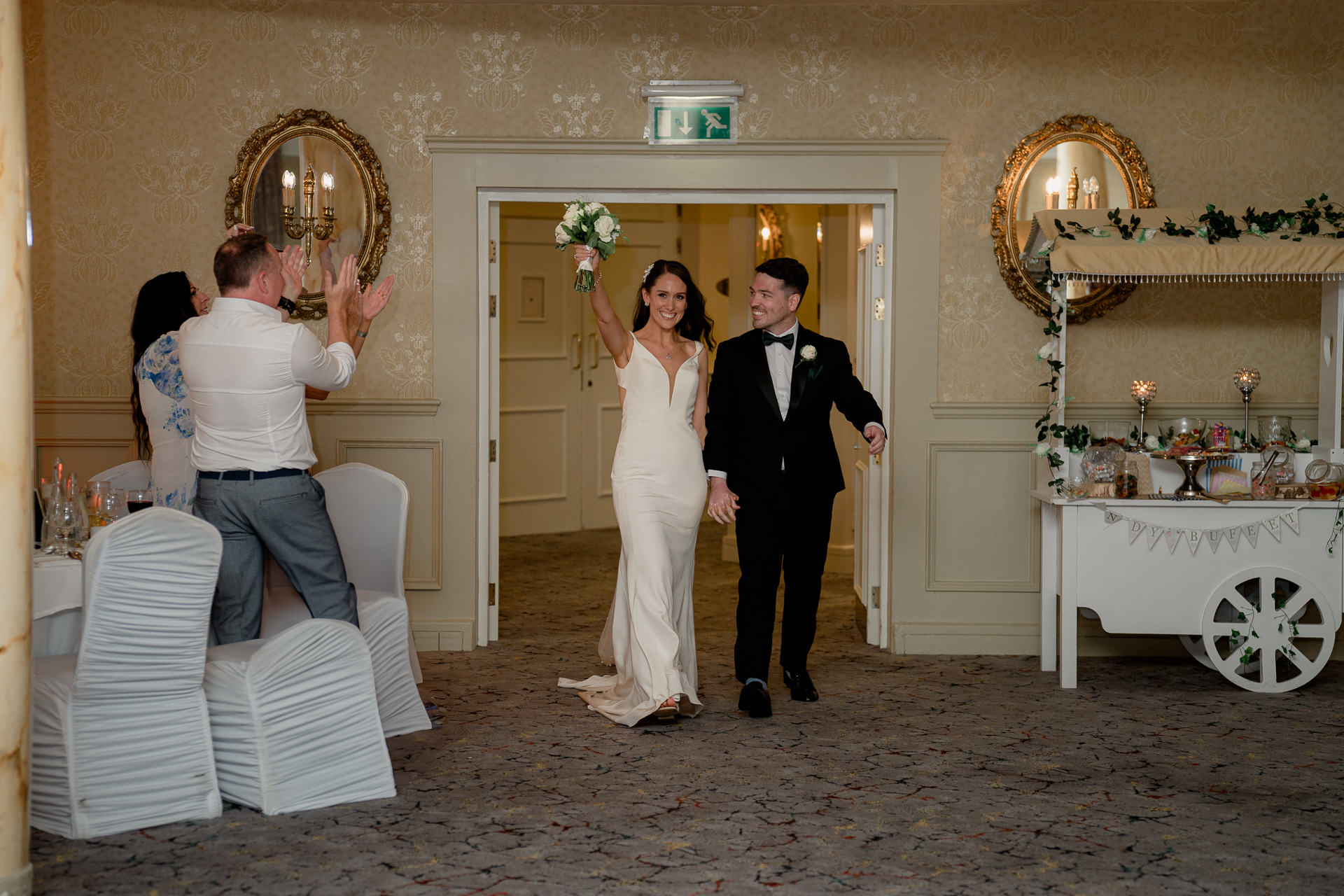 A bride and groom posing for a picture