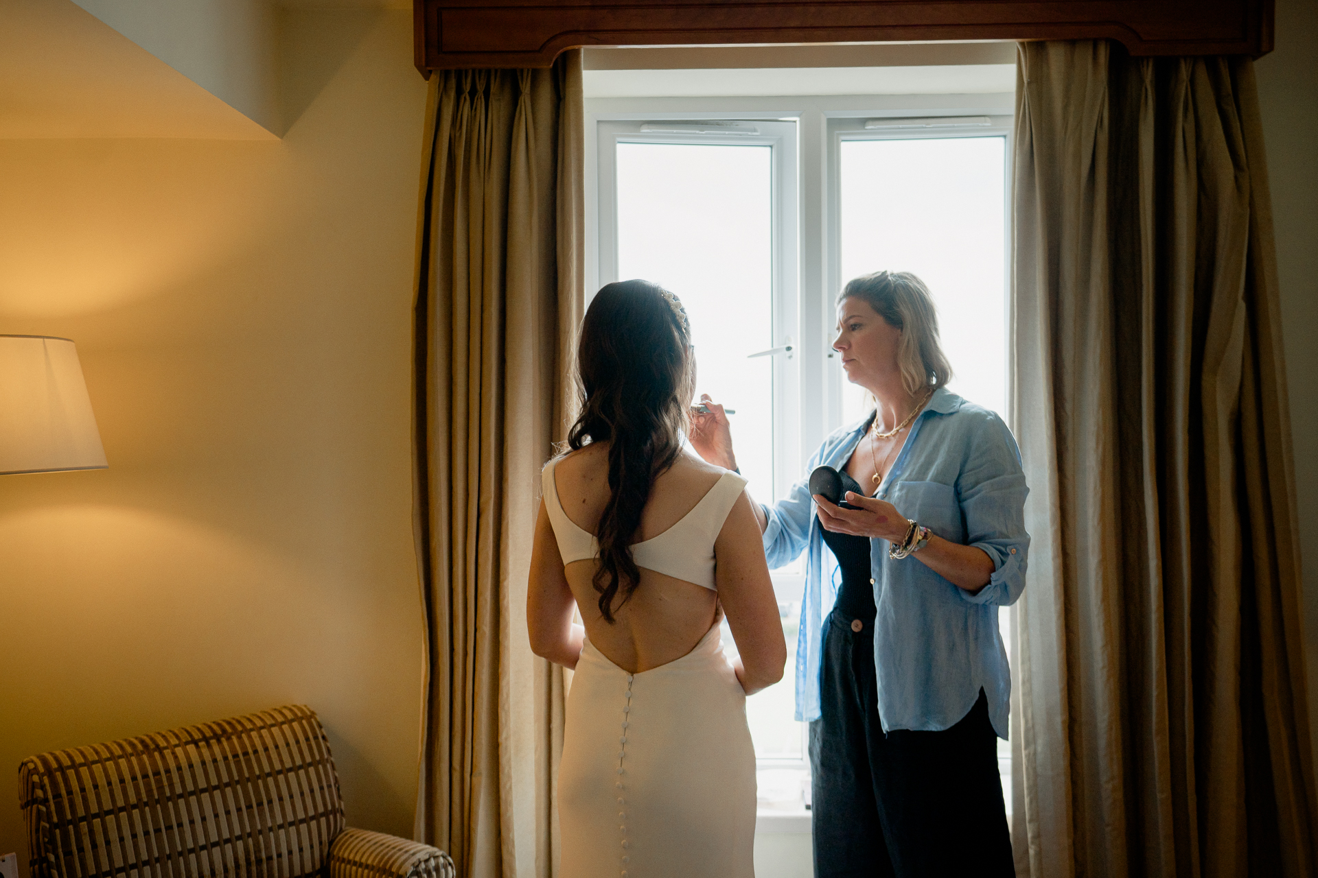 A person in a white dress and a person in a white dress