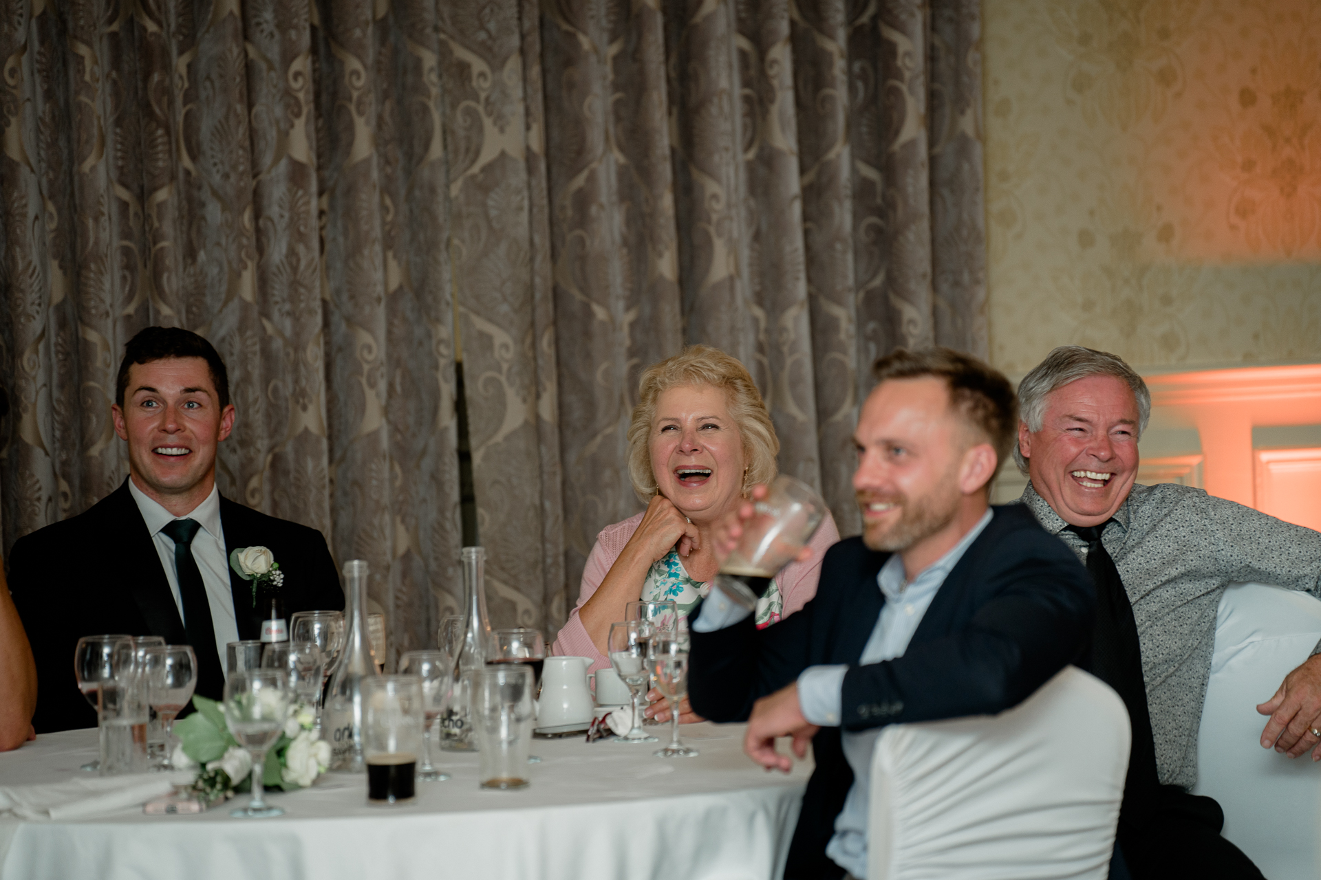 A group of people sitting at a table with drinks