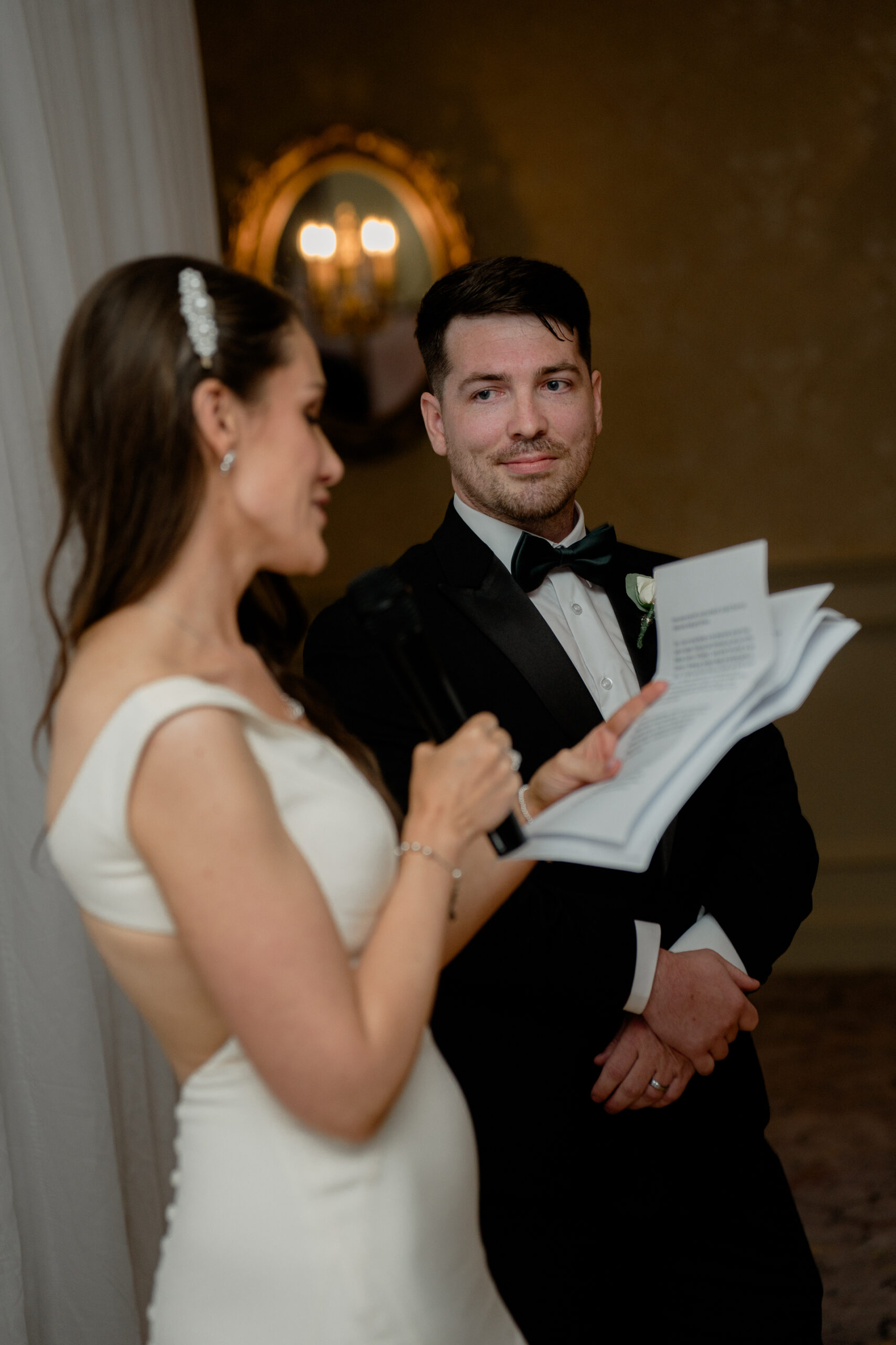 A man and woman holding a piece of paper