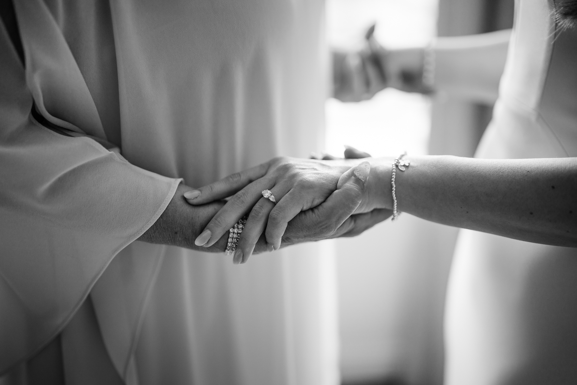 A woman and a man holding hands