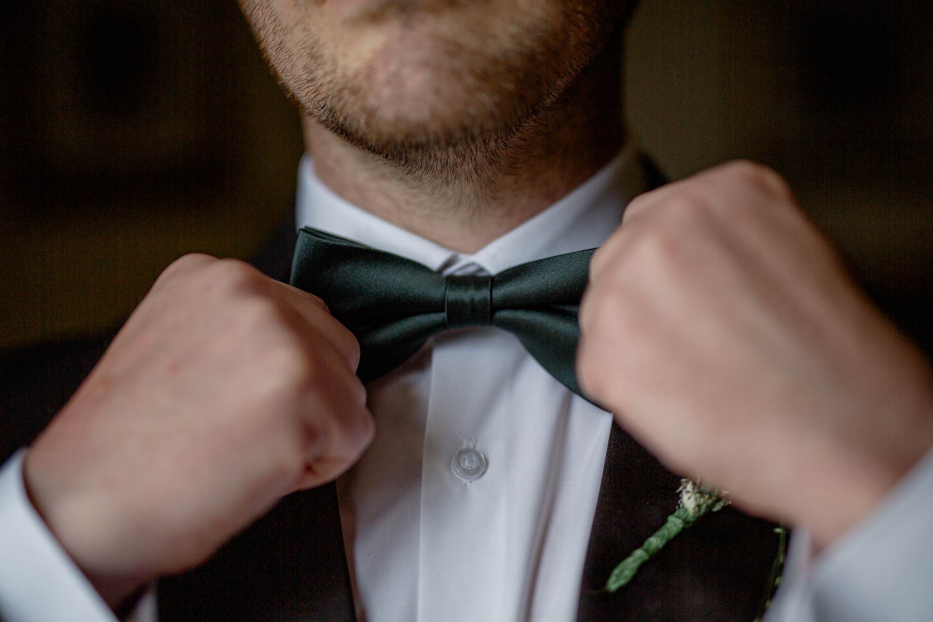 A man adjusting his tie