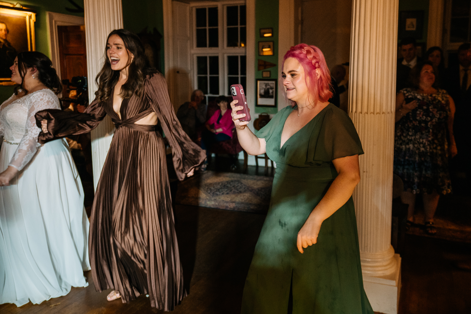 A group of women in dresses dancing