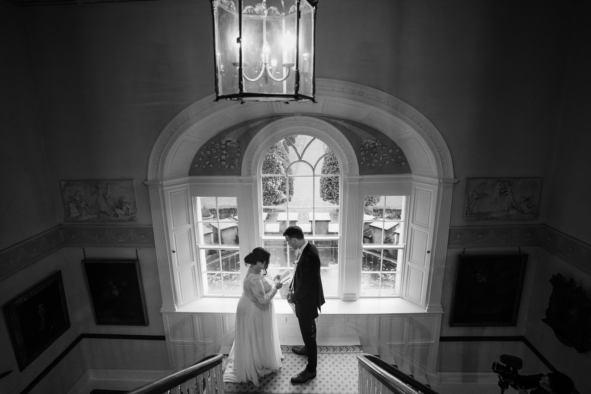 A bride and groom kissing in a church