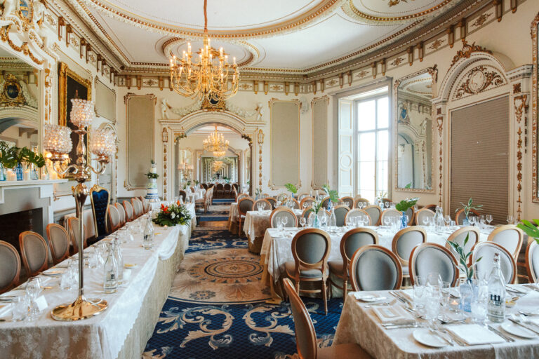 Luxury wedding table setup at Markree Castle with elegant floral decor and candlelit ambiance.