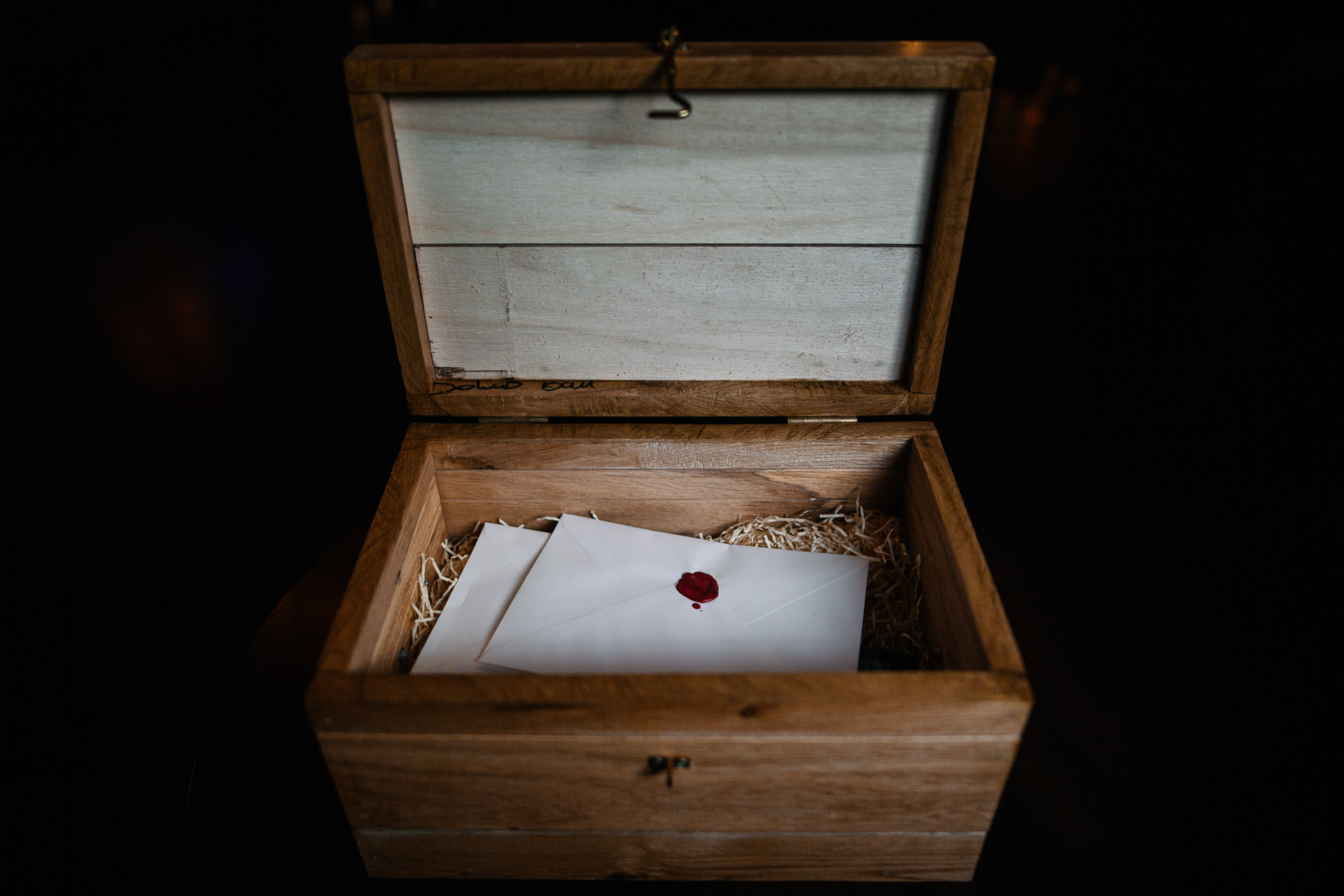 A wooden chest with a heart on it