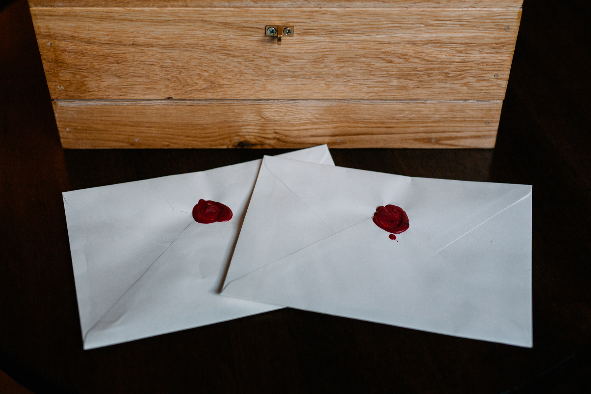 A white envelope with a red heart on it