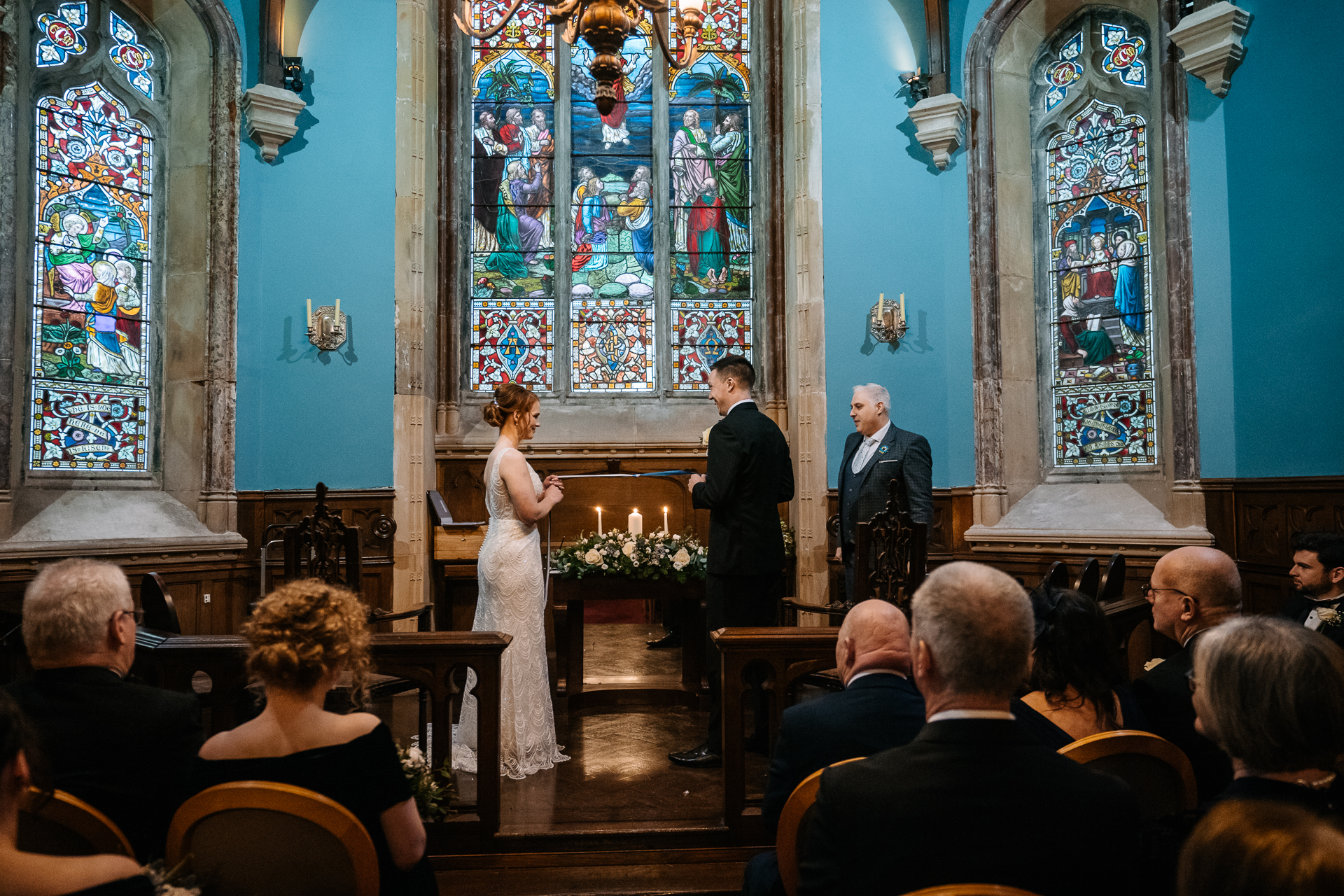 A bride and groom walking down the aisle