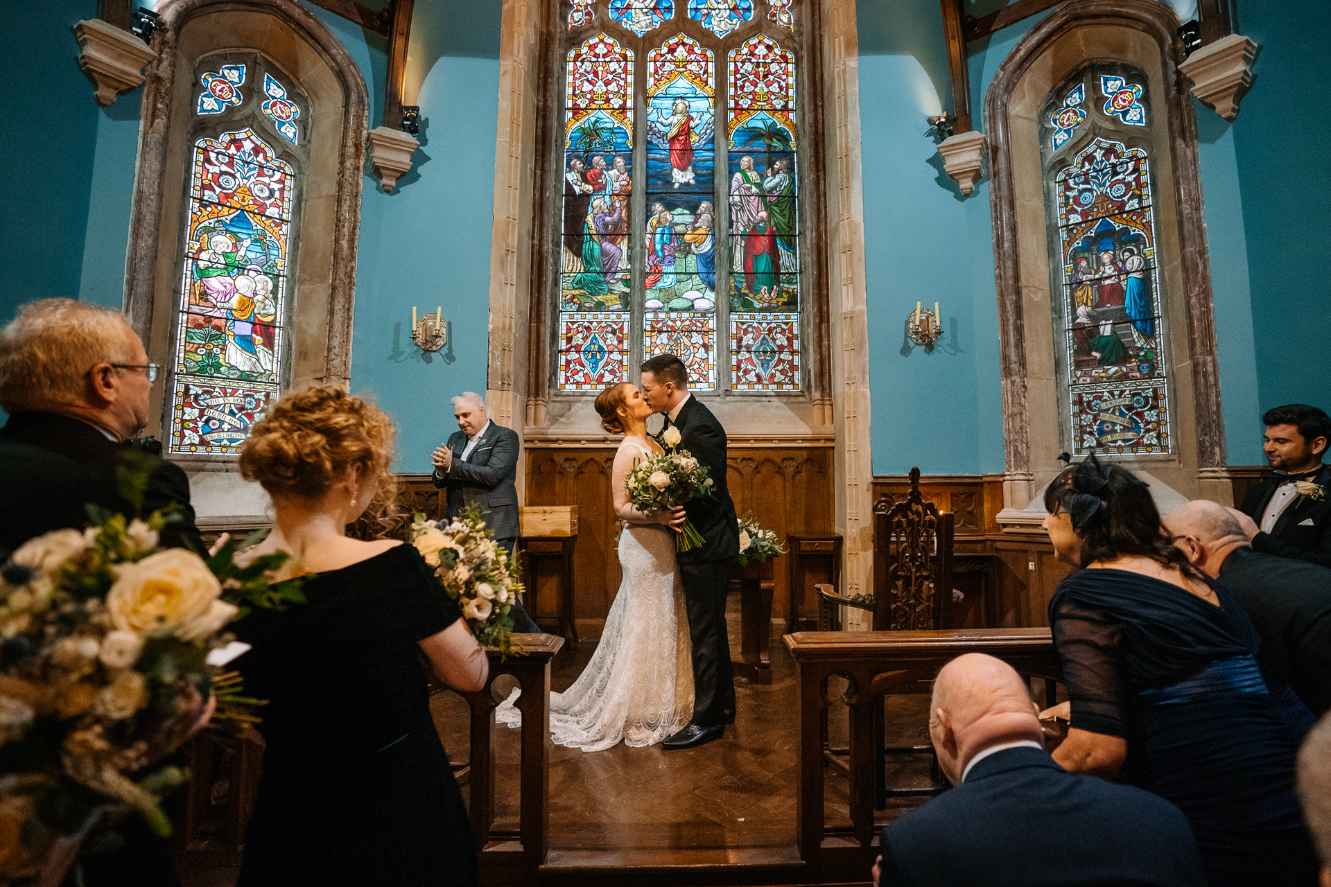 A bride and groom walking down the aisle