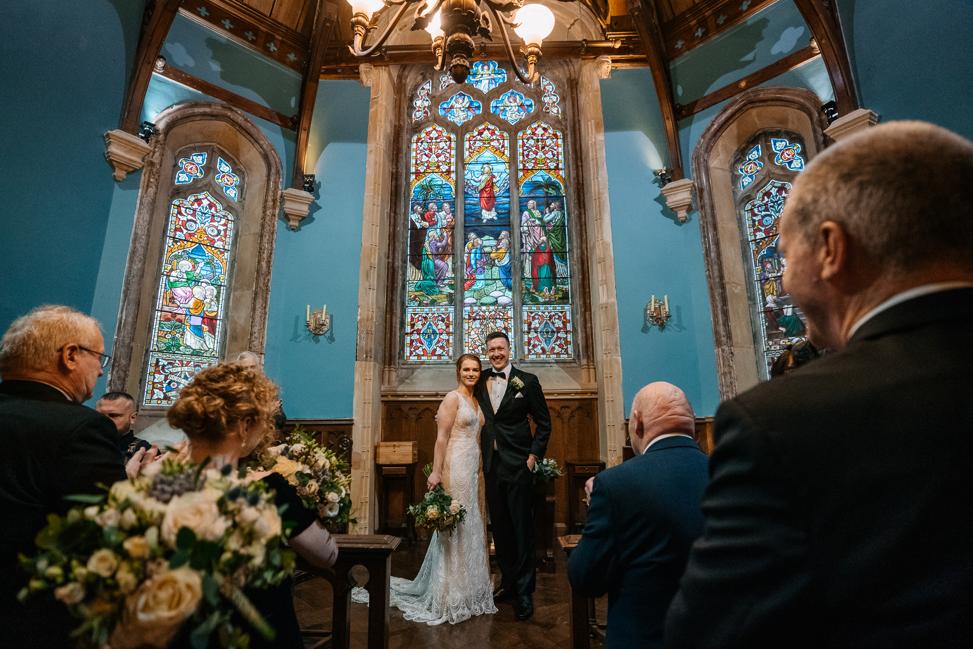 A bride and groom walking down the aisle