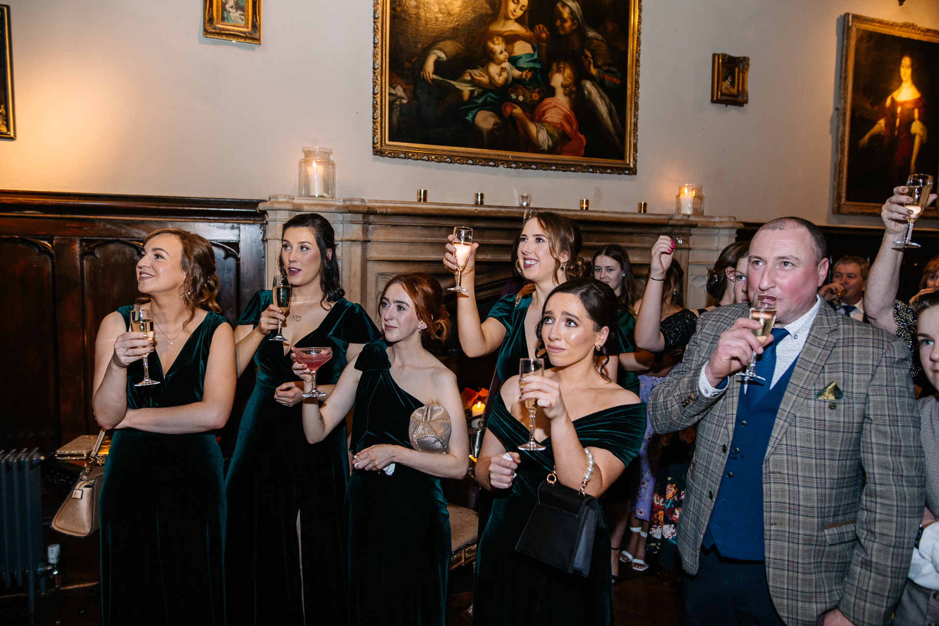 A group of people holding glasses