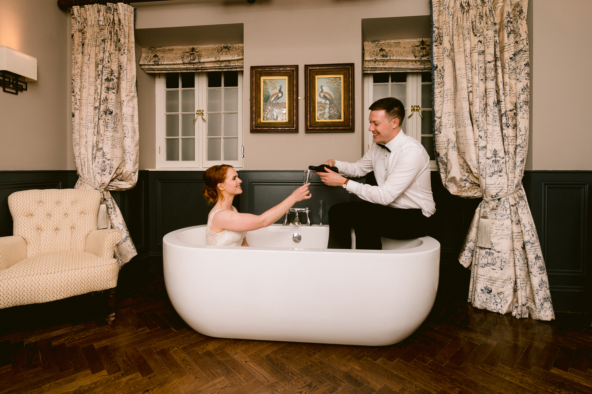 A man and woman sitting in a bathtub