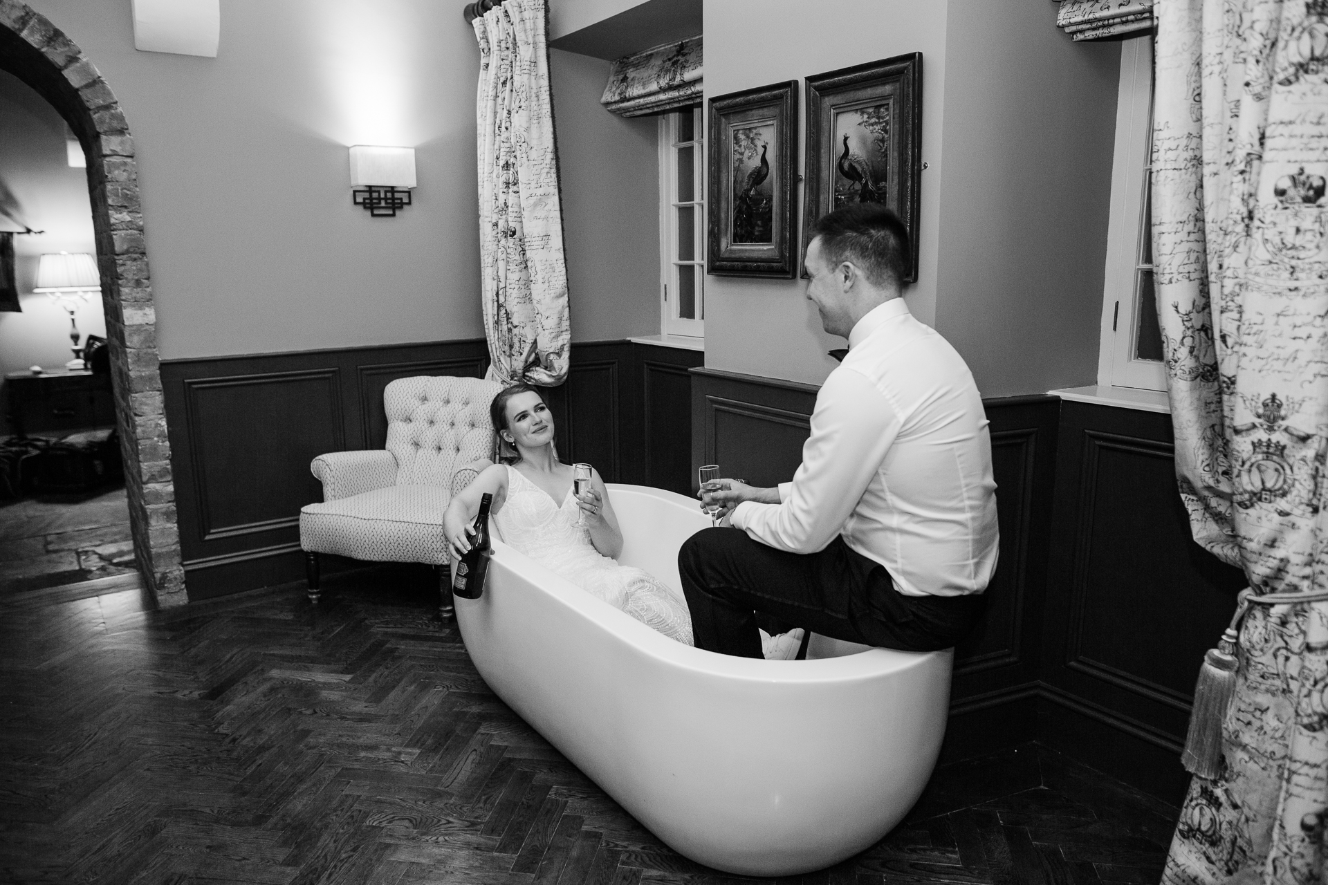 A man and a woman sitting on a couch in a room