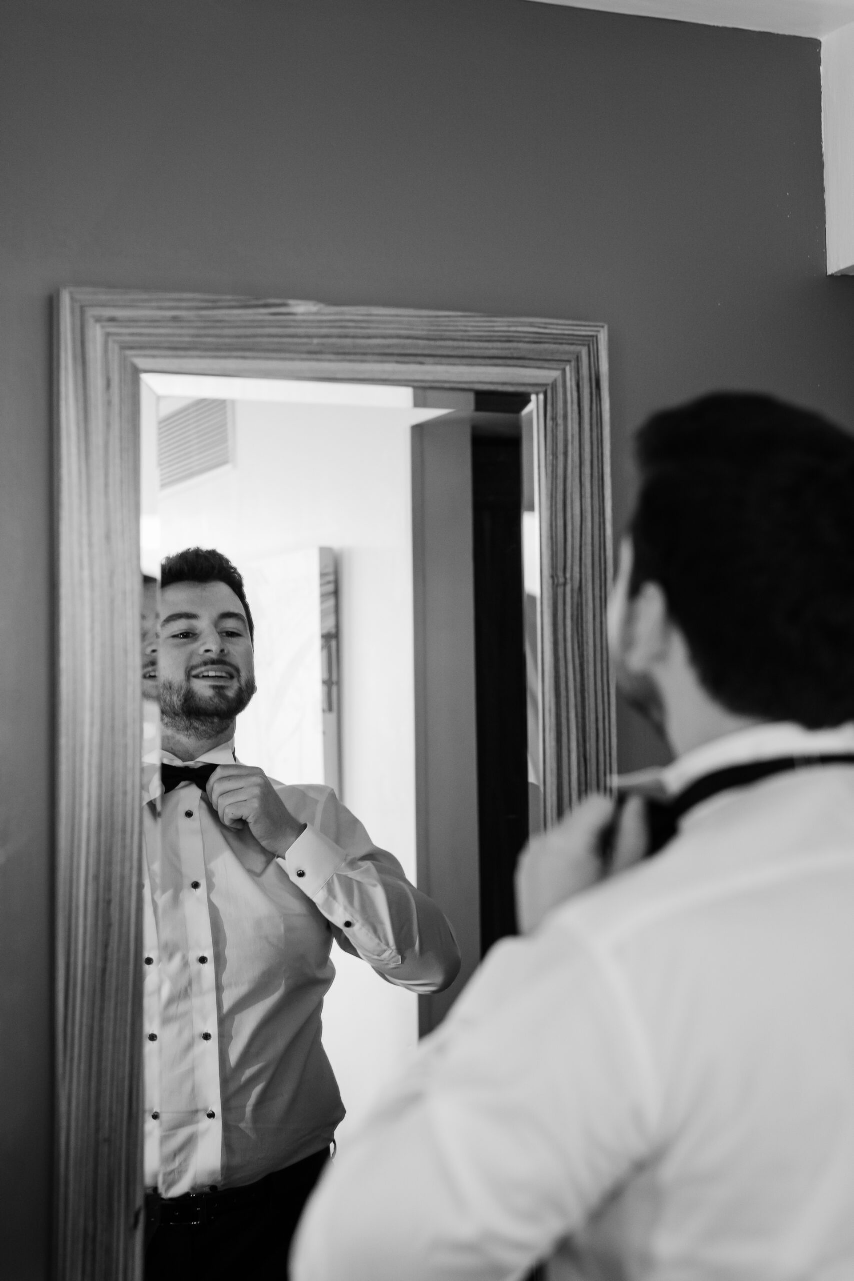 A man tying his tie