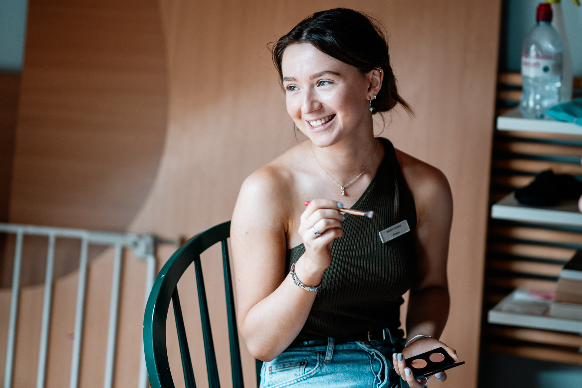 A woman holding a remote control