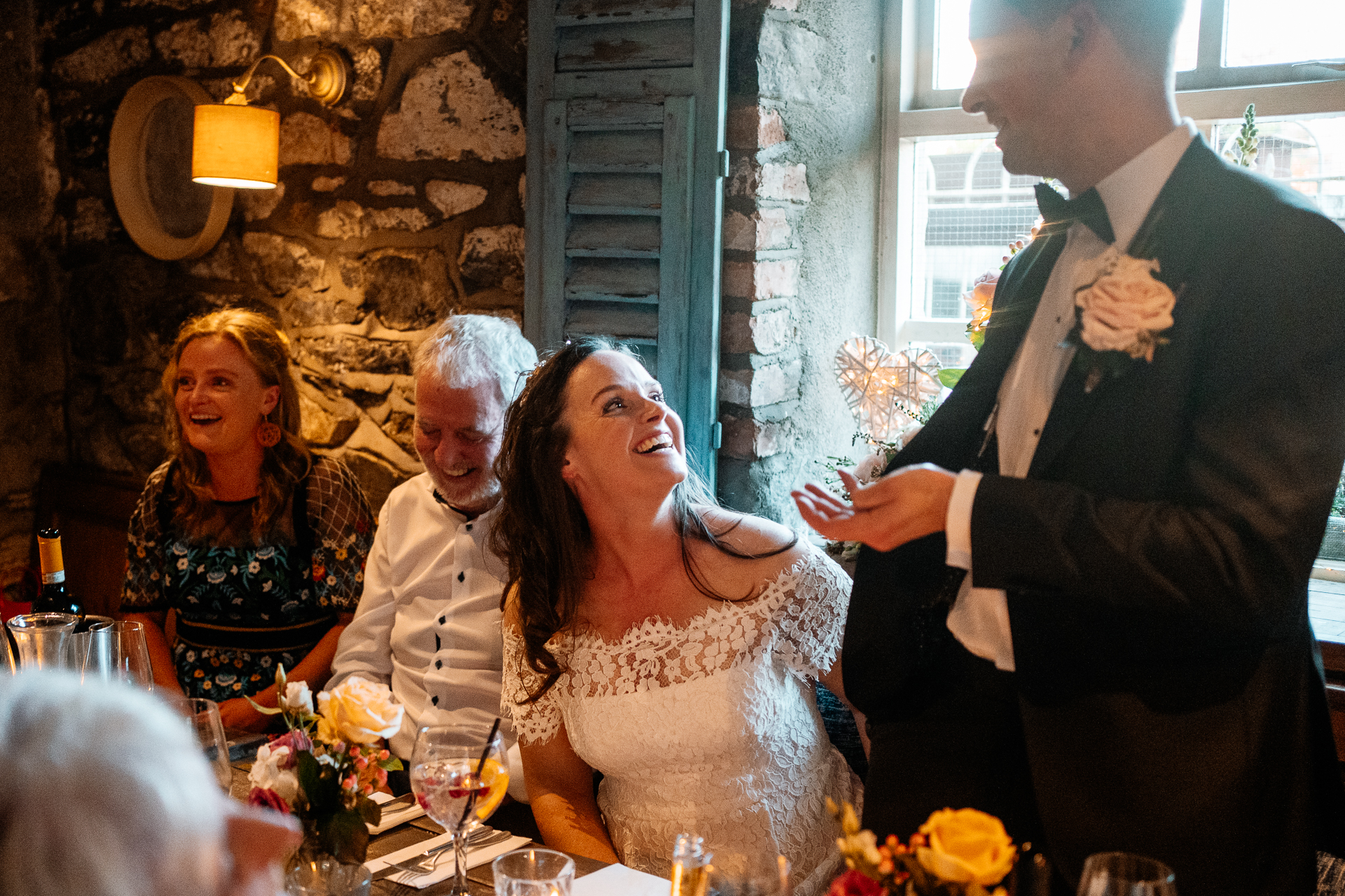 A bride and groom dancing at a wedding reception