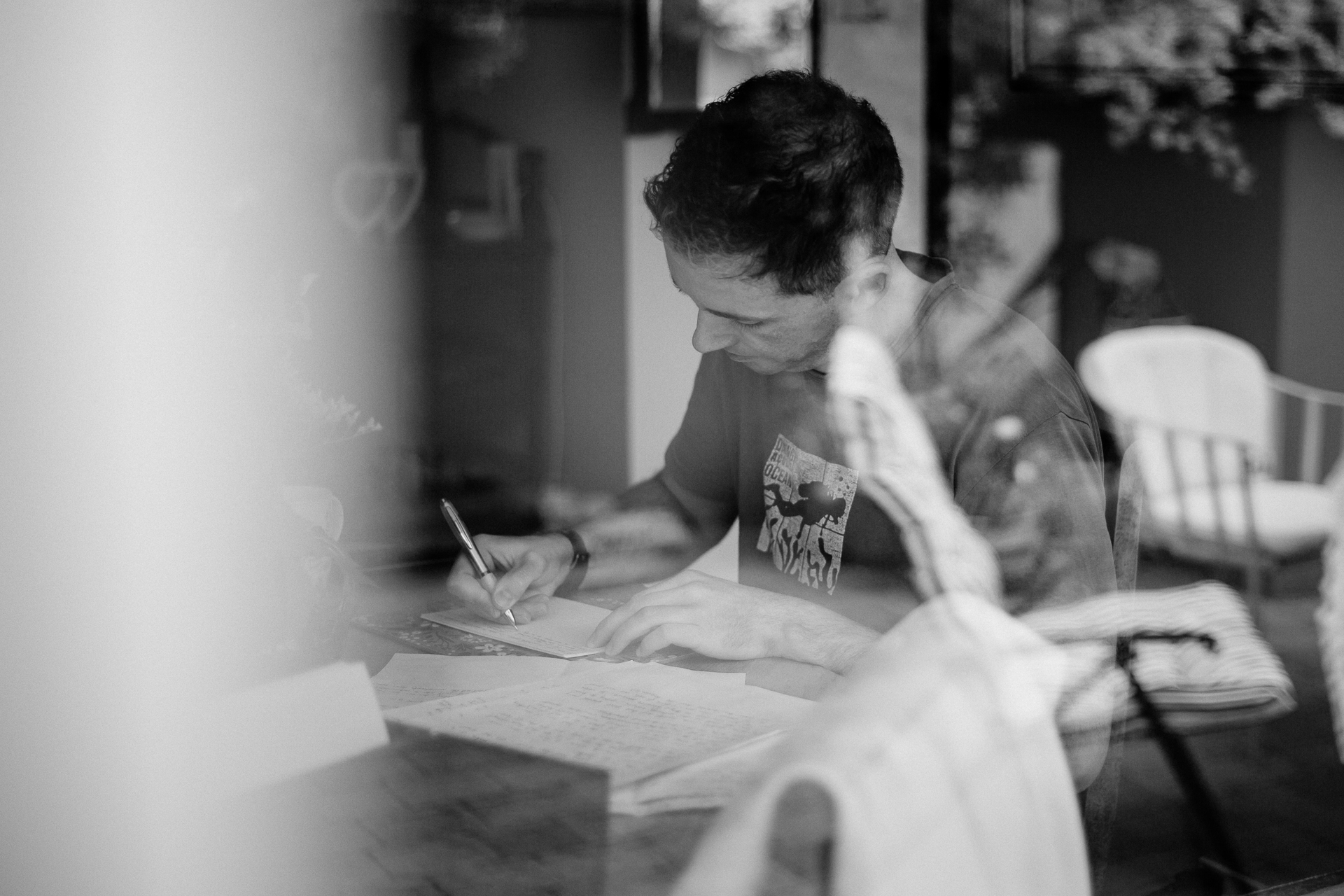 A person writing on a piece of paper